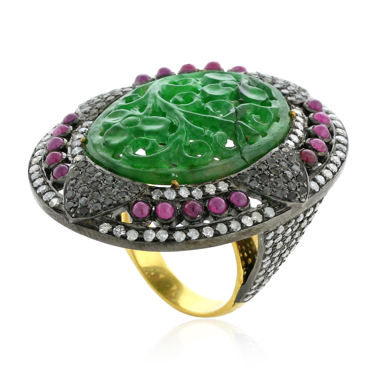 Pretty in green this Hand Craved Jade Ring with Diamond & Rubies in silver and gold can be worn well with any color dress from a casual to a formal evening.

Ring Size: 7  ( Can be sized )

18k: 4.6gms
Diamond: 2.88cts
Slv: