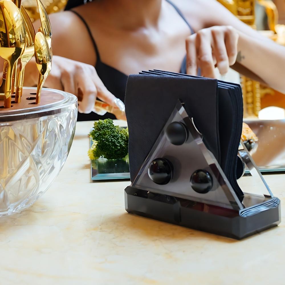  Elevate your dining experience with this hand-cut crystal napkin holder, a sculptural tabletop accent that merges modernist design with old-world craftsmanship. Crafted from premium lead-free crystal, this piece features a refined elliptical shape,