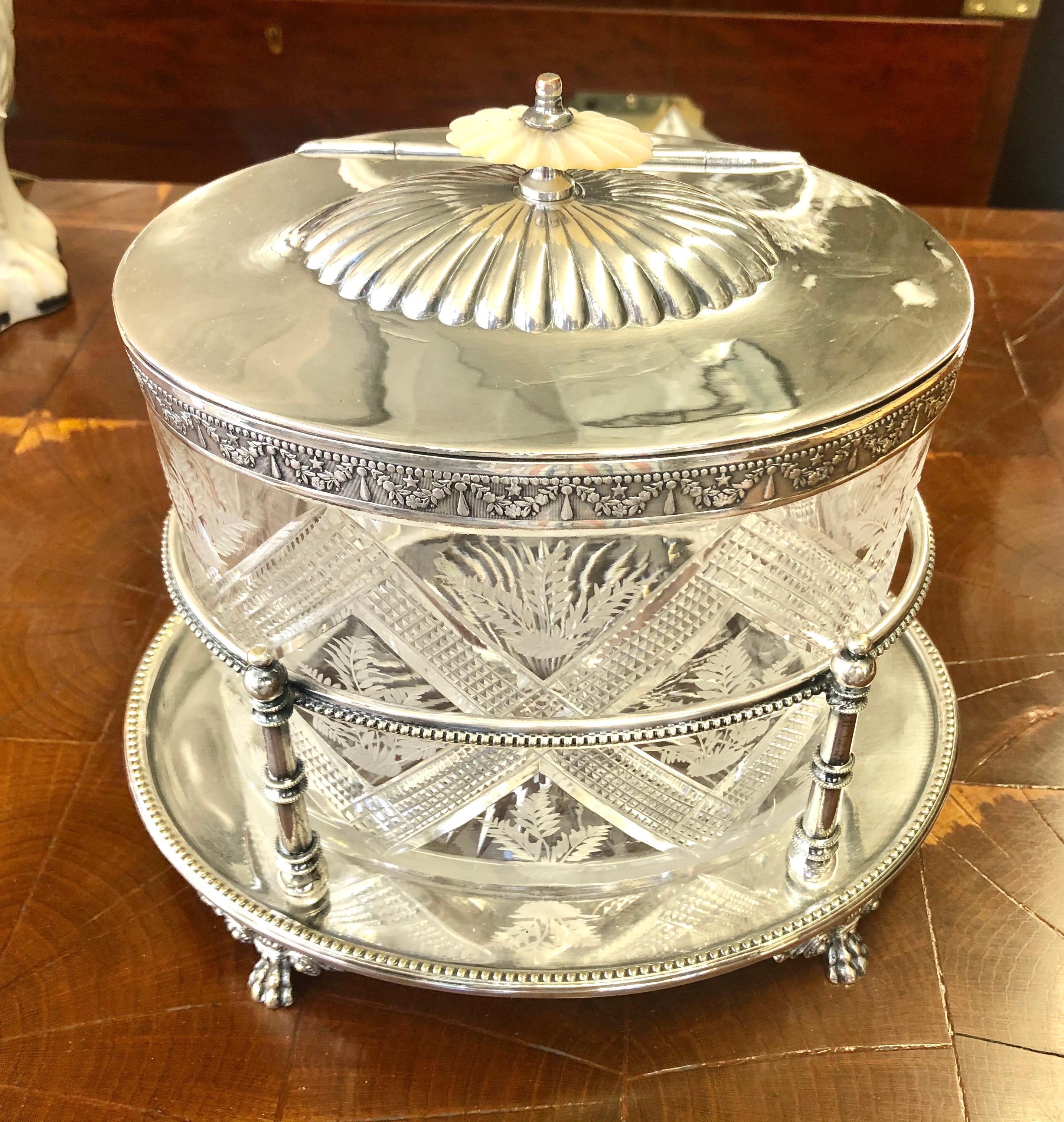 Finest quality handcut crystal and Sheffield silver plated oval biscuit box on stand with mother of pearl finial and 