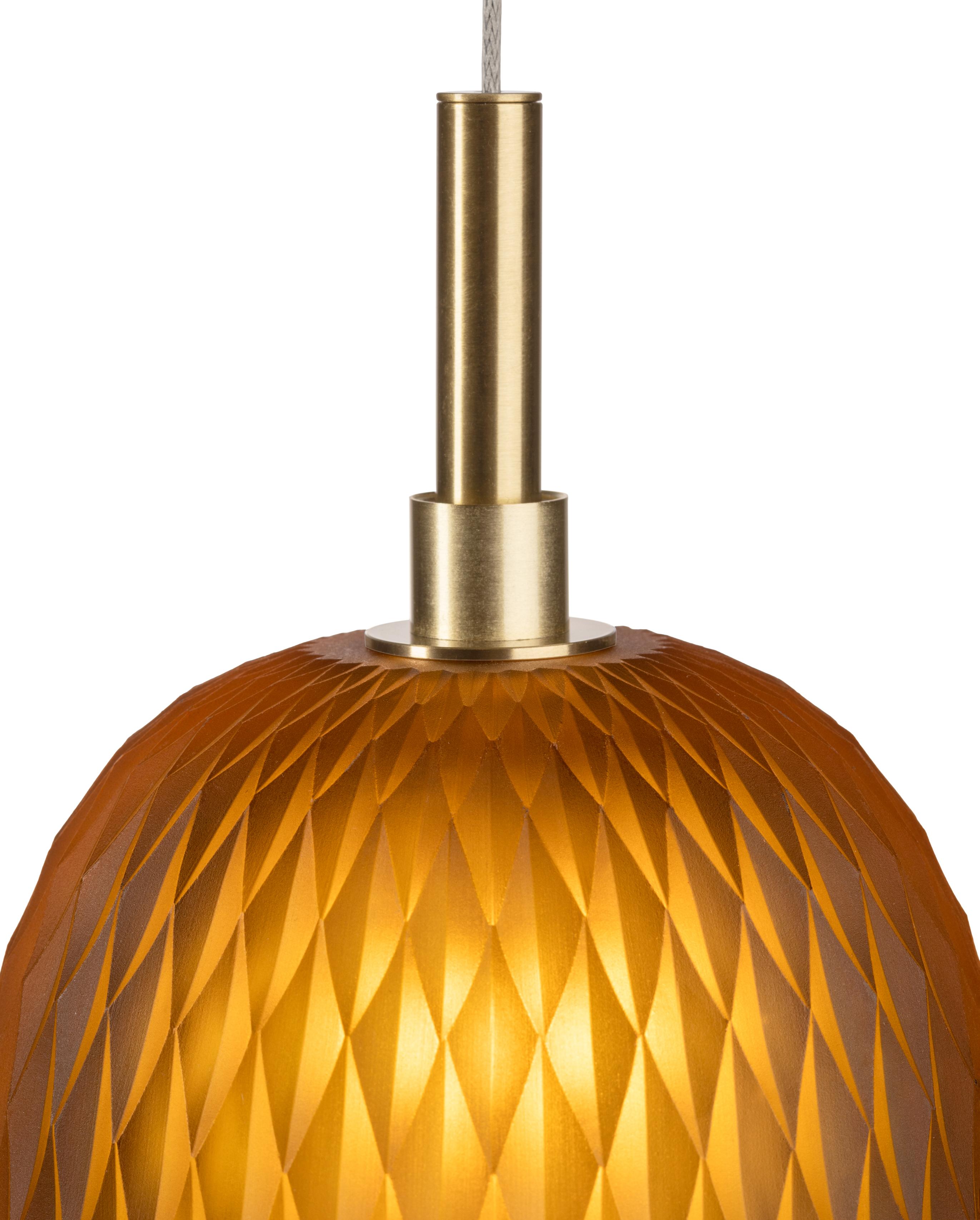 Designed by Rony Plesl

The Metamorphosis Pendant was created by transforming crystal into a stunning lighted jewel. It is a display of both craftsmanship and technical execution. It features a delicate geometric cut of hand-blown crystal. 

Each