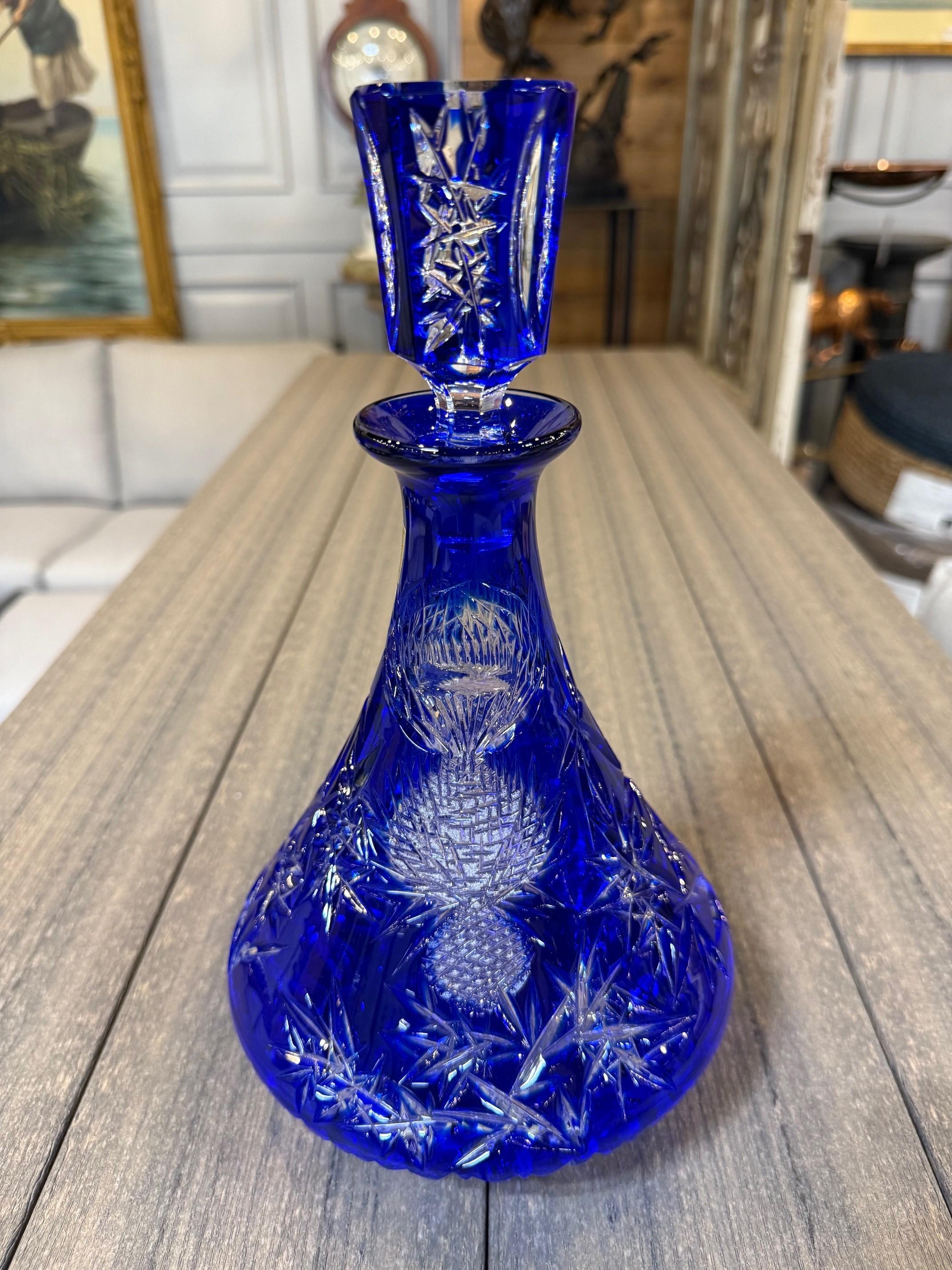 Stunning cobalt blue hand cut lead crystal lidded decanter created as a work of art by the hands of the finest Czech glass workers. The Caesar Crystal Company in the Czech Republic has been selling hand cut lead crystal pieces since 1861 and is