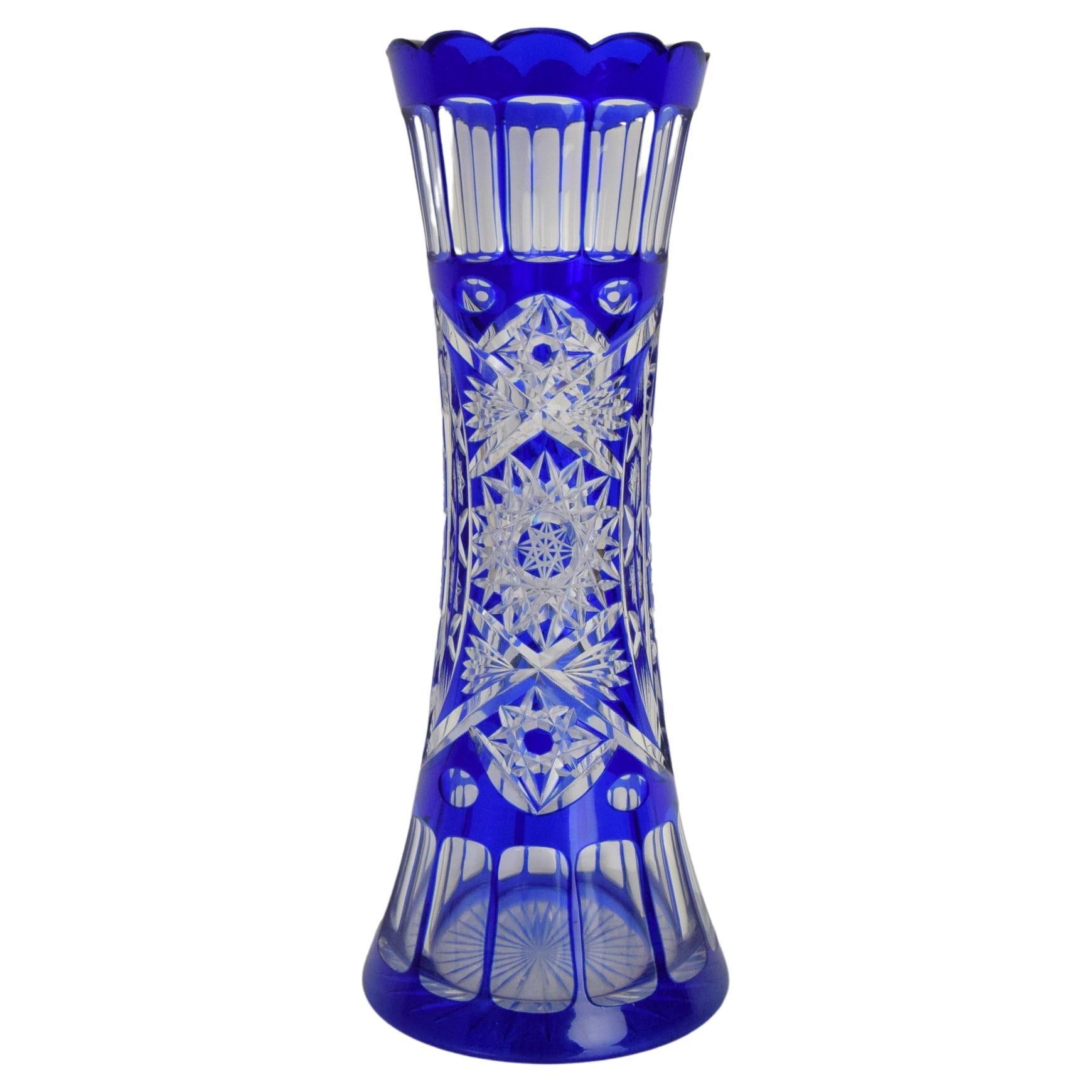 Made in Czechoslovakia.
Made of crystal glass.
The vase has small chip (see photo)
Original condition.
 