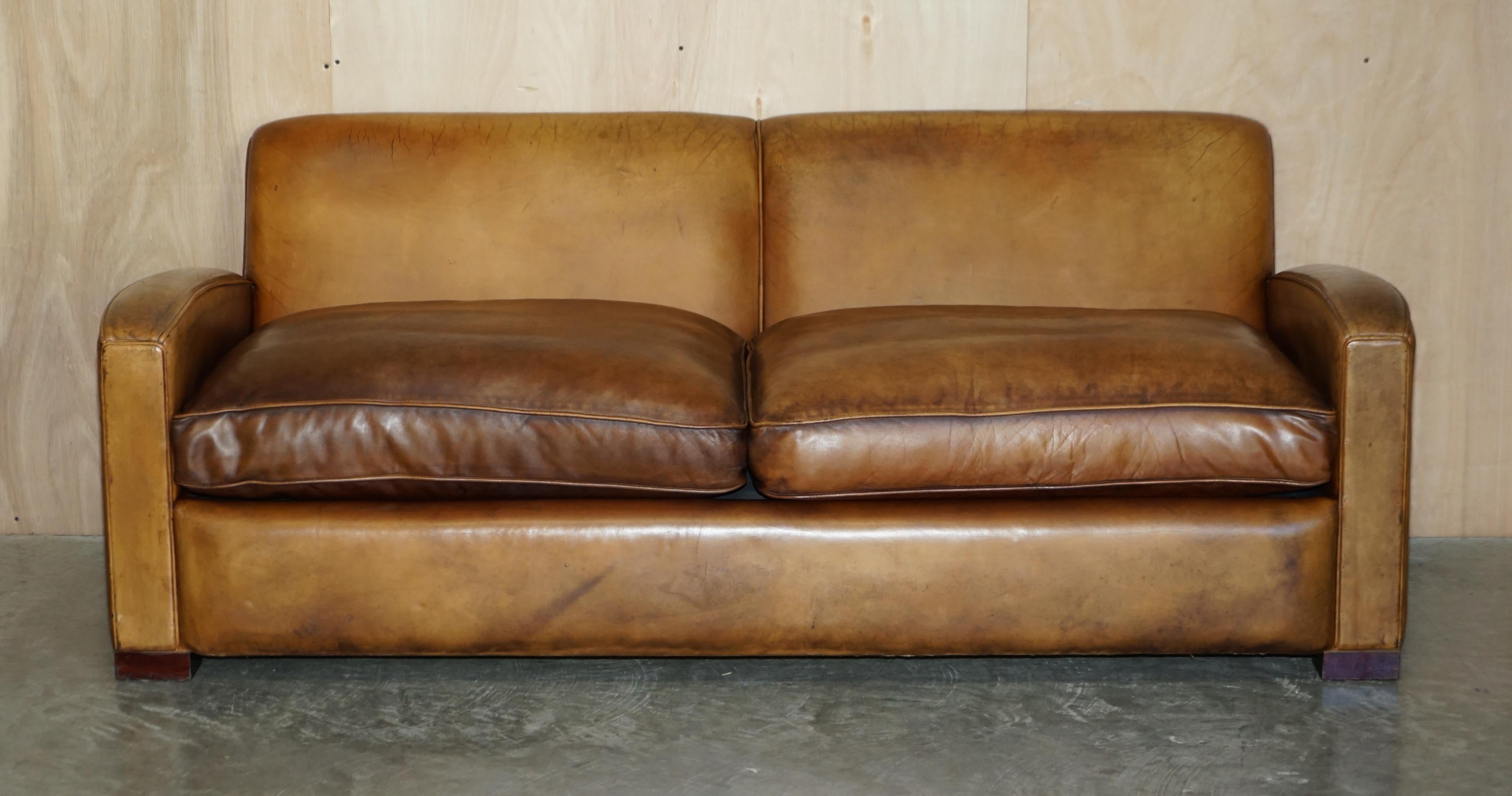 We are delighted to offer for sale this lovely vintage hand made in England Art Deco Odeon style brown leather sofa with overstuffed feather filled cushions

A good looking well made and decorative sofa, its upholstered with plain Scottish cattle