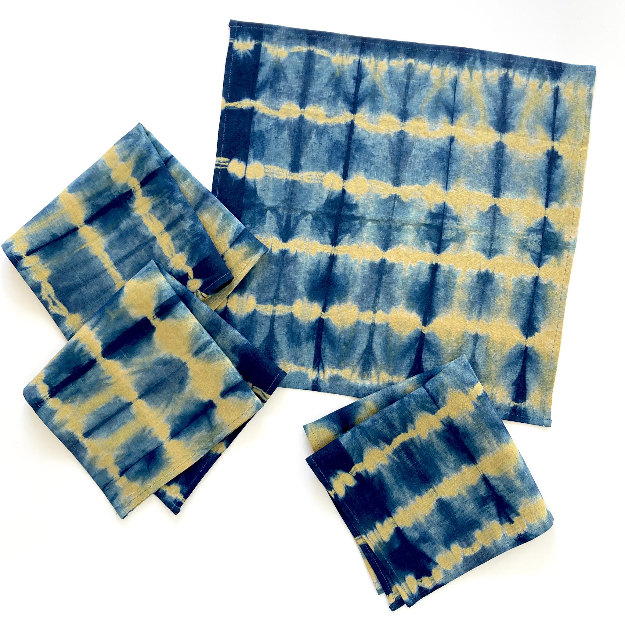 Gold linen napkins, set of four, dyed with indigo in Pleat pattern. Hand-dyed and sewn in New York City. Napkins measure approximately 18 x 18 inches. Each linen napkin is hand dyed and one of a kind. 

Each linen panel is cut and folded by hand, in