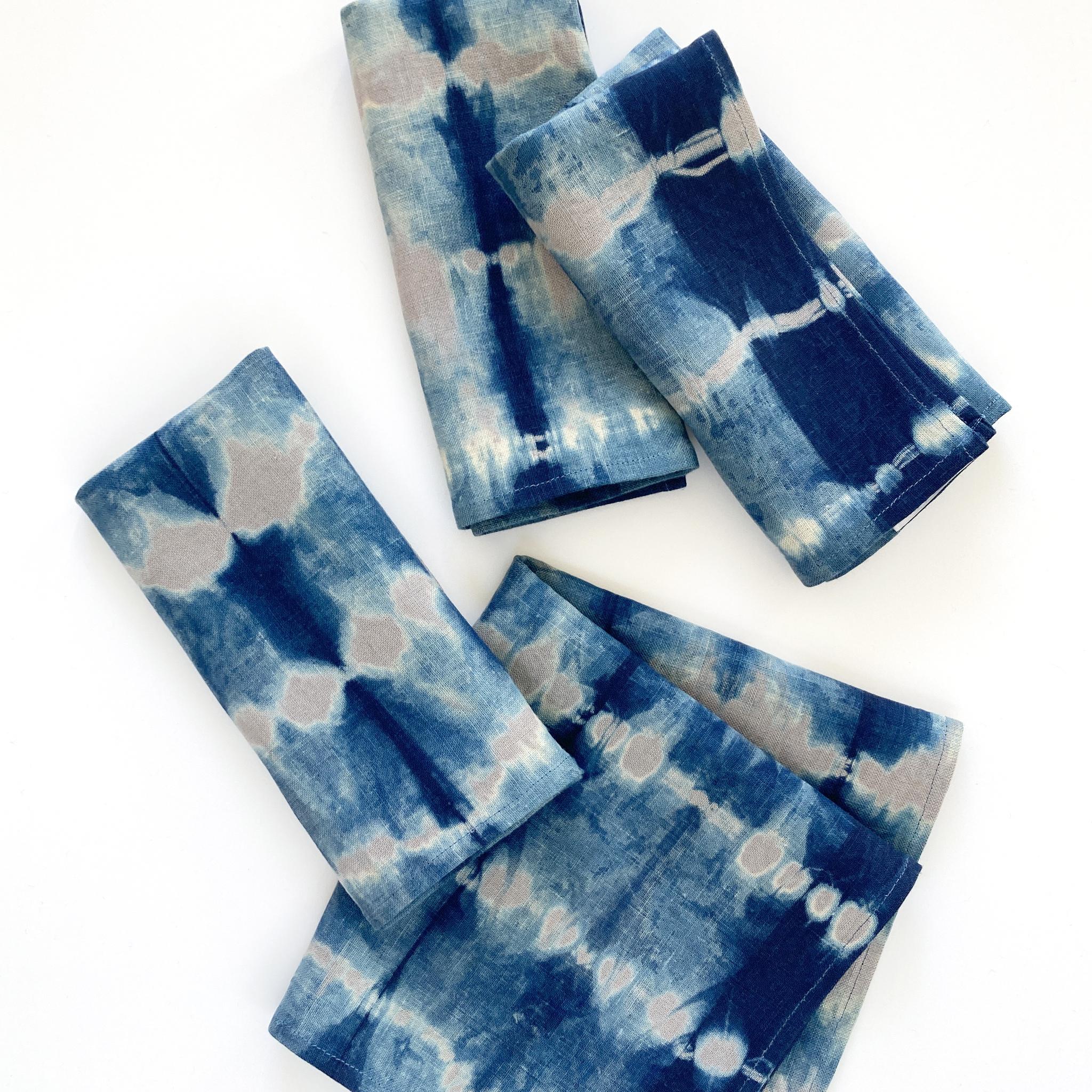 Silver gray linen napkins, set of four, dyed with indigo in Pleat pattern. Hand-dyed and sewn in New York City. Napkins measure approximately 18 x 18 inches. Each linen napkin is hand dyed and one of a kind. 

Each linen panel is cut and folded by