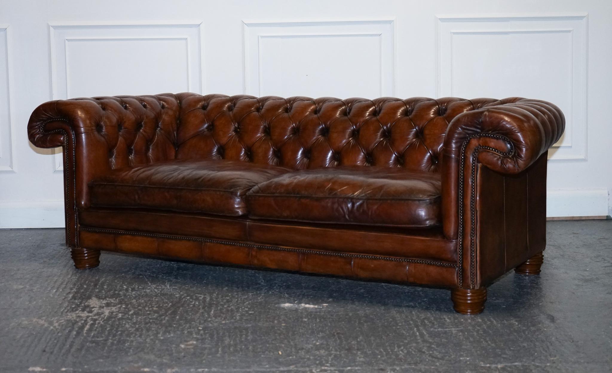 
We are delighted to offer for sale this Gorgeous Hand Dyed Restored Whiskey Brown Leather Chesterfield Club Sofa.

A beautifully well-made and solid Chesterfield sofa. On the bottom back it seems that there was some sort of badge, but we are not