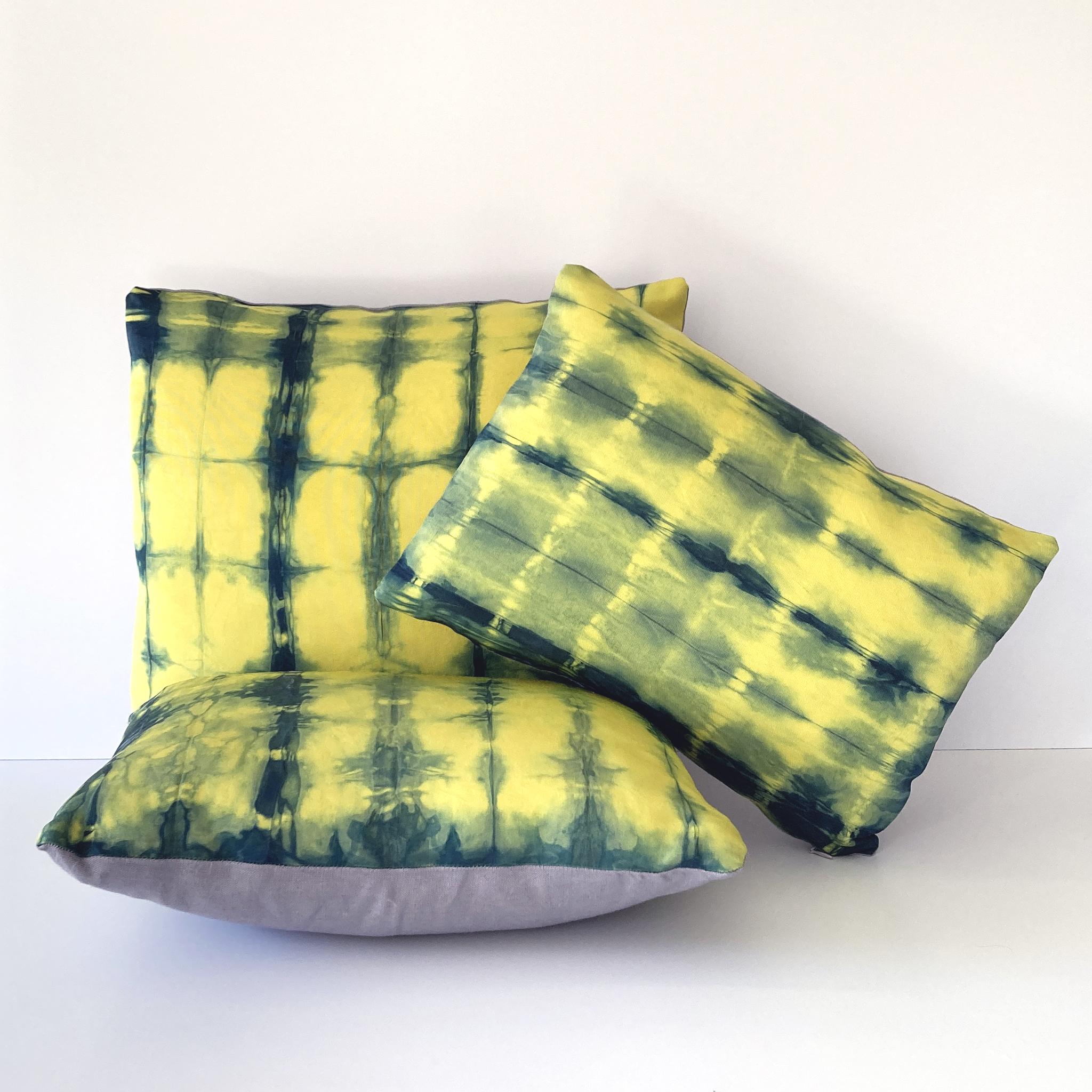Canary yellow silk faille pillow dyed with indigo in Dash pattern with gray linen backing. Hand-dyed and sewn in New York City, down pillow insert made locally in NYC. Pillow measures 12 x 16 inches. Each silk pillow is hand made and one of a
