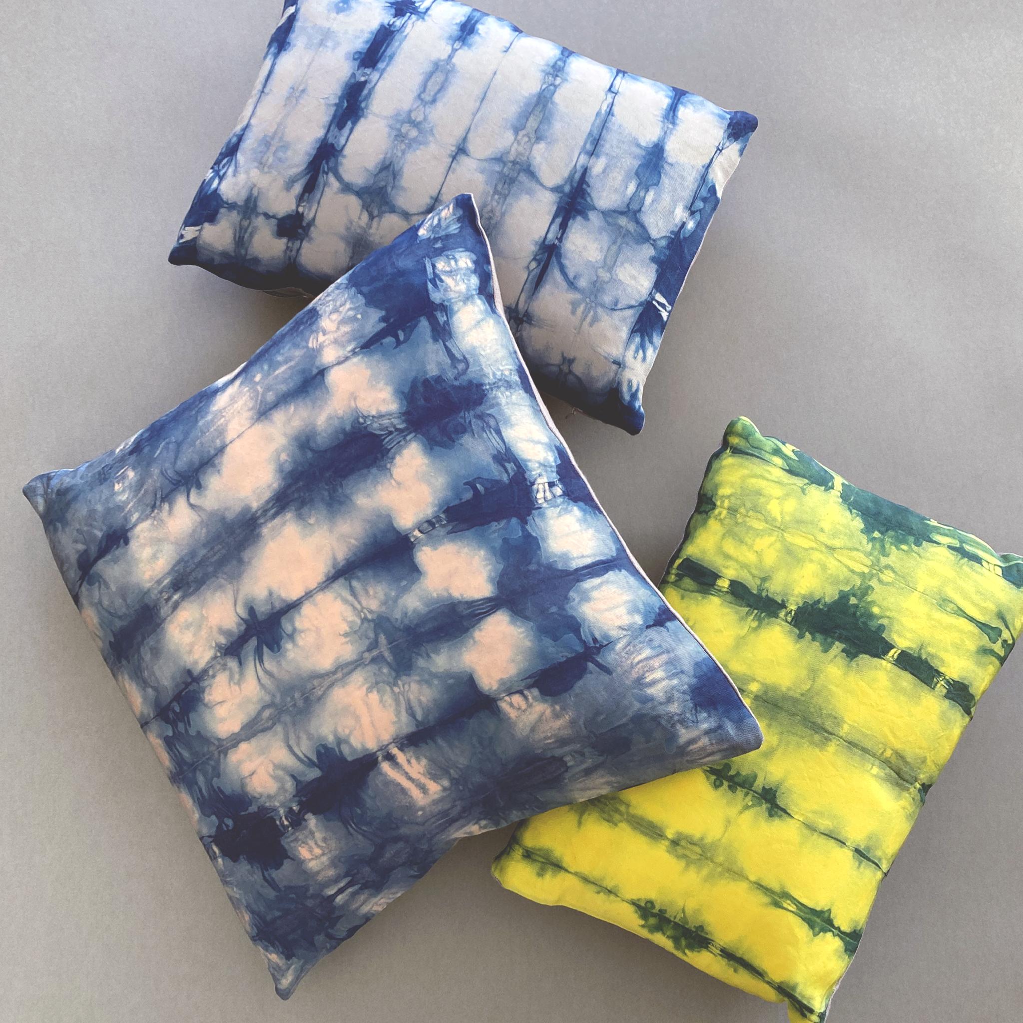 Canary yellow silk faille pillow dyed with indigo in Ripple pattern with gray linen backing. Hand-dyed and sewn in New York City, down pillow insert made locally in NYC. Pillow measures 12 x 16 inches. Each silk pillow is hand made and one of a