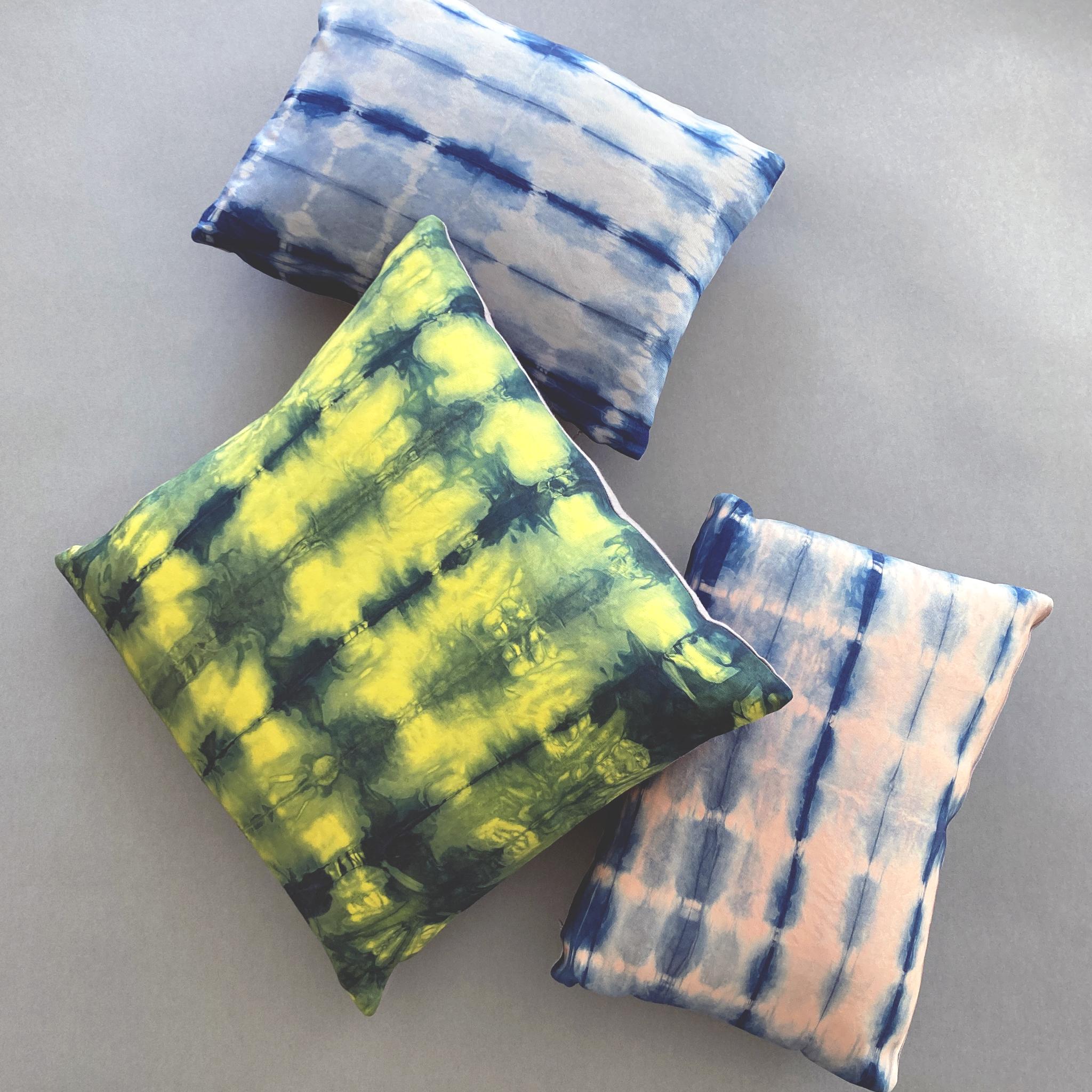 Canary yellow silk faille pillow dyed with indigo in Wave pattern with gray linen backing. Hand-dyed and sewn in New York City, down pillow insert made locally in NYC. Pillow measures 18 x 18 inches. Each silk pillow is hand made and one of a
