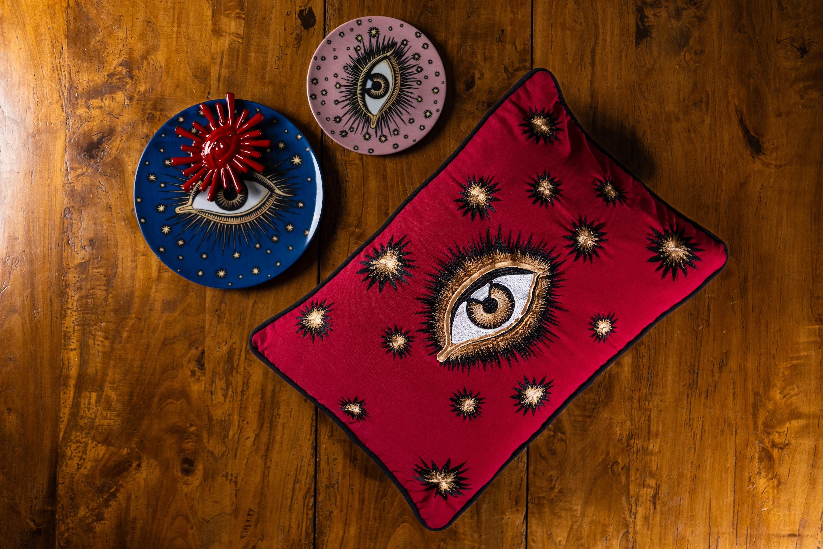 Add intrigue and personality to your space with our cotton cushion featuring a beautifully hand-embroidered eye design. Perfect for layering on a sofa or bed, this is an eye-catching accent piece for any decor.