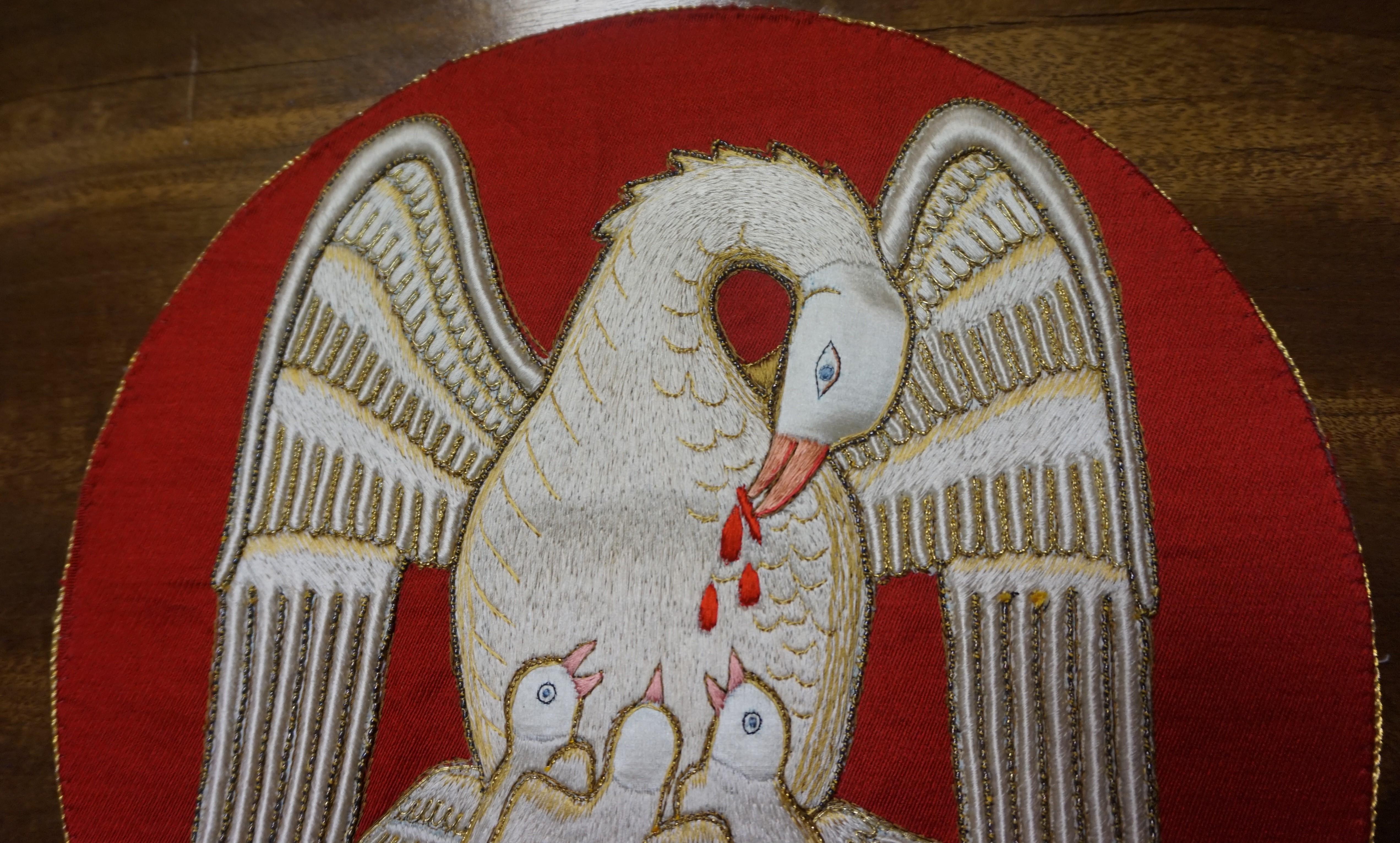 Also from the collection of unique, handcrafted religious artefacts.

This rare and meaningful symbol in Christianity was all handcrafted in the mid-20th century. The perfectly embroidered pelican and babies are made of top quality silk and copper