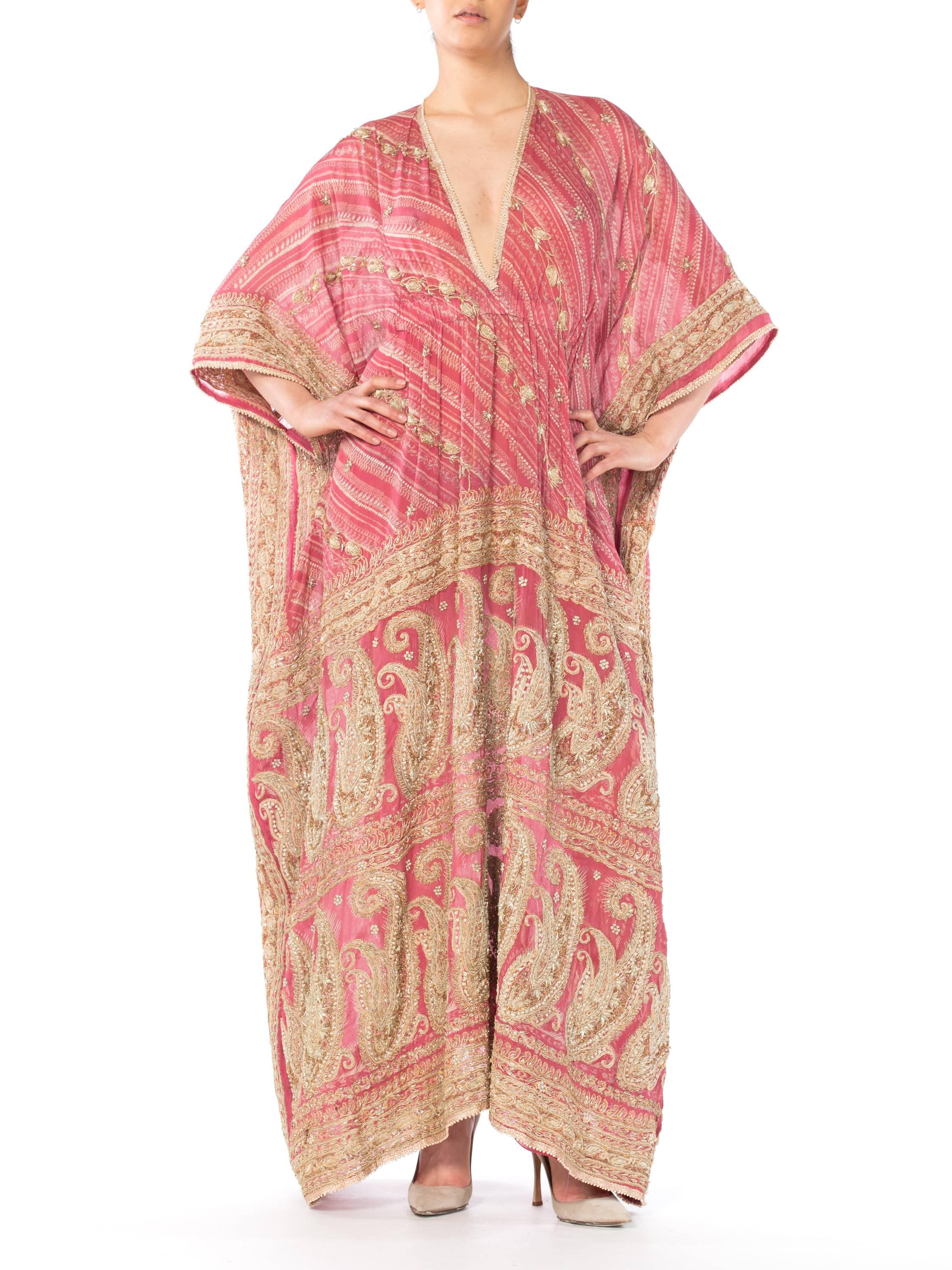 This Kaftan is made from a vintage silk Sari which is completely embroidered with traditional metal and thread Indian Embroidery 