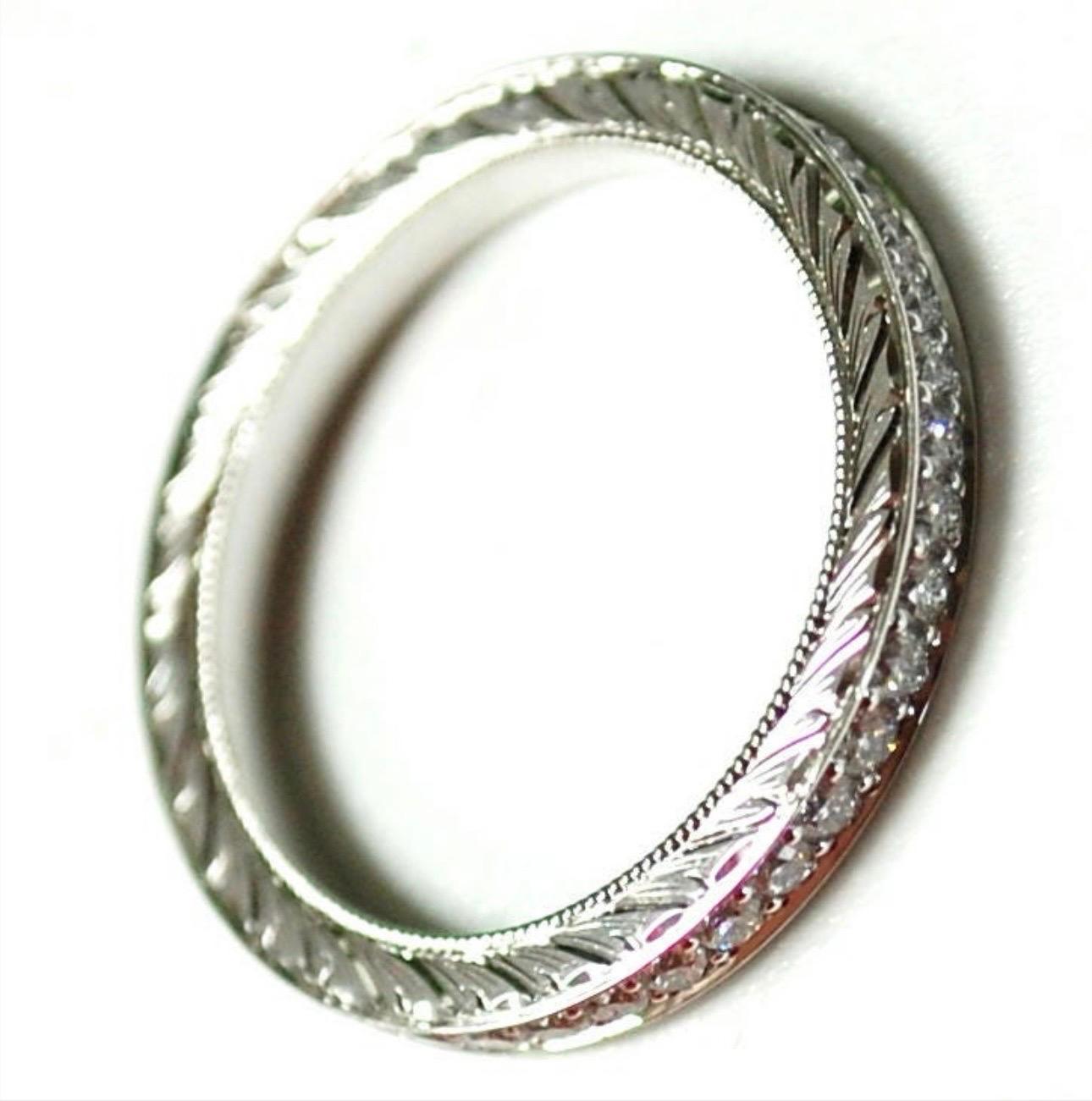A wedding ring like no other, both sides are hand engraved which takes a long time and effort. Ring is made in eternity style with VS diamons and F color. Ring is size 6.5 and cannot be re-sized.

Certificate of authenticity comes with