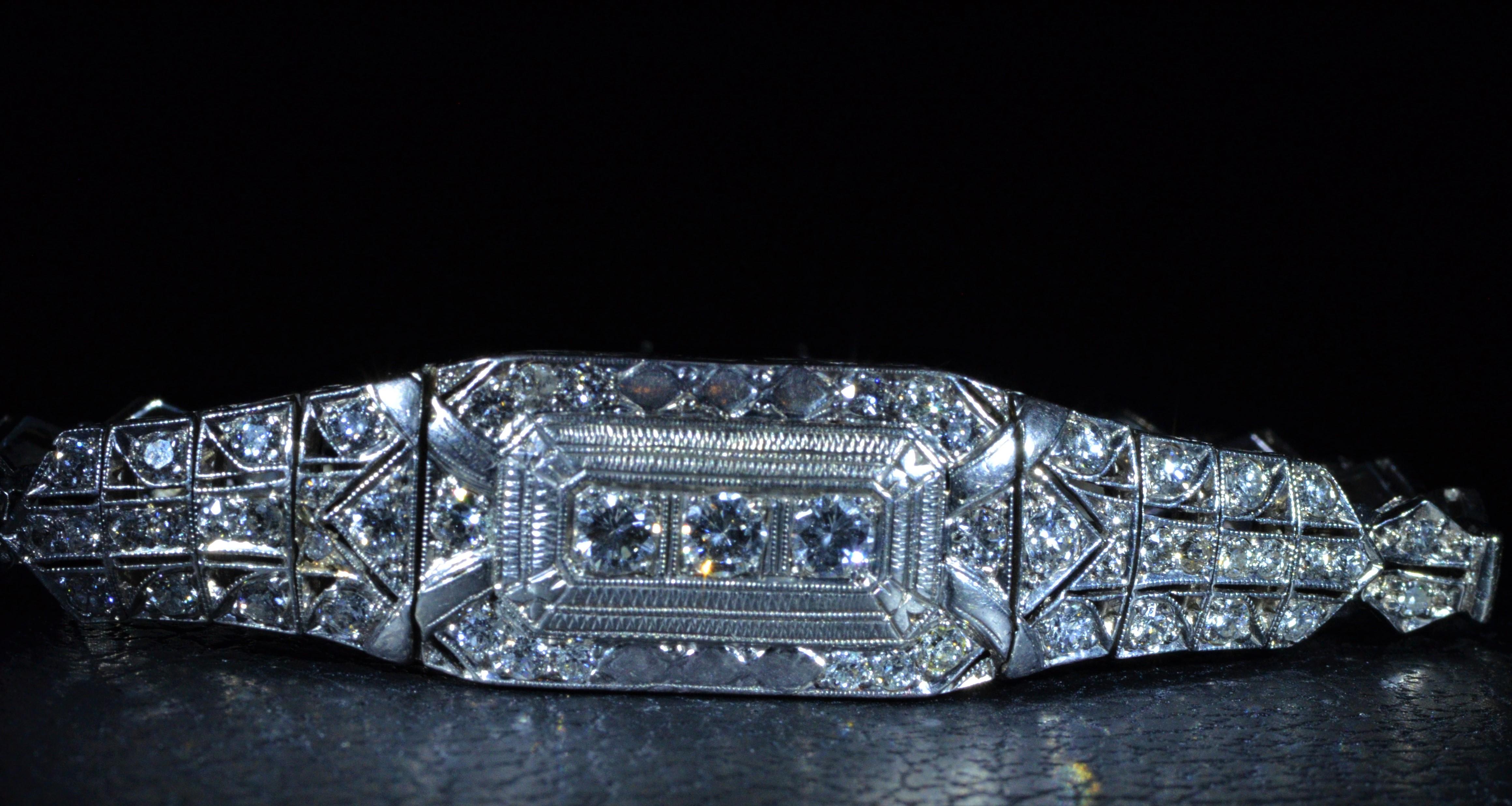 Hand Engraved Filigree Bracelet set with 2 Carats Total Weight in Diamonds.  The diamonds have an approximate Gemological Institute of America clarity grade of Vs1 to Vs2 and a color grade of F to G and are a combination of transitional and old