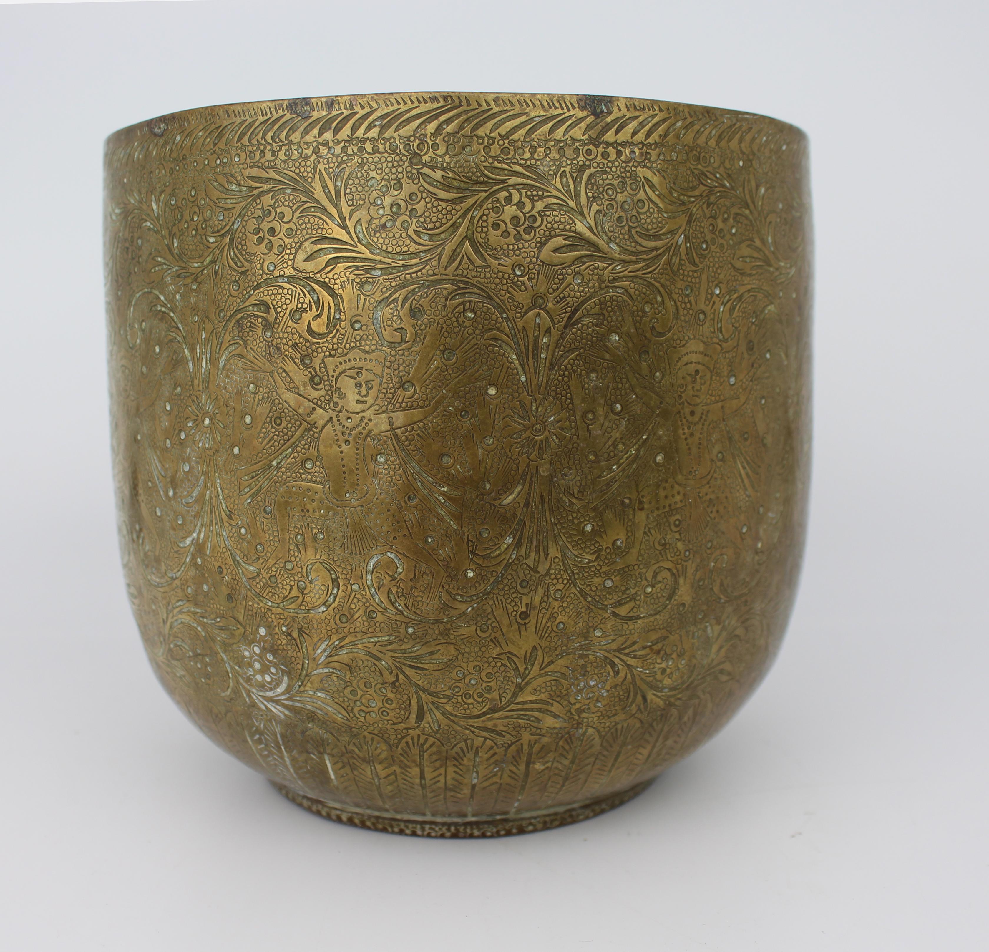 Hand-Engraved Indian Brass Jardinière or Cachepot, Circa 1880
An elegant late 19th century Indian brass jardinière or cachepot of circular form, profusely decorated with finely hand-engraved foliate and floral motifs throughout.

Executed with care
