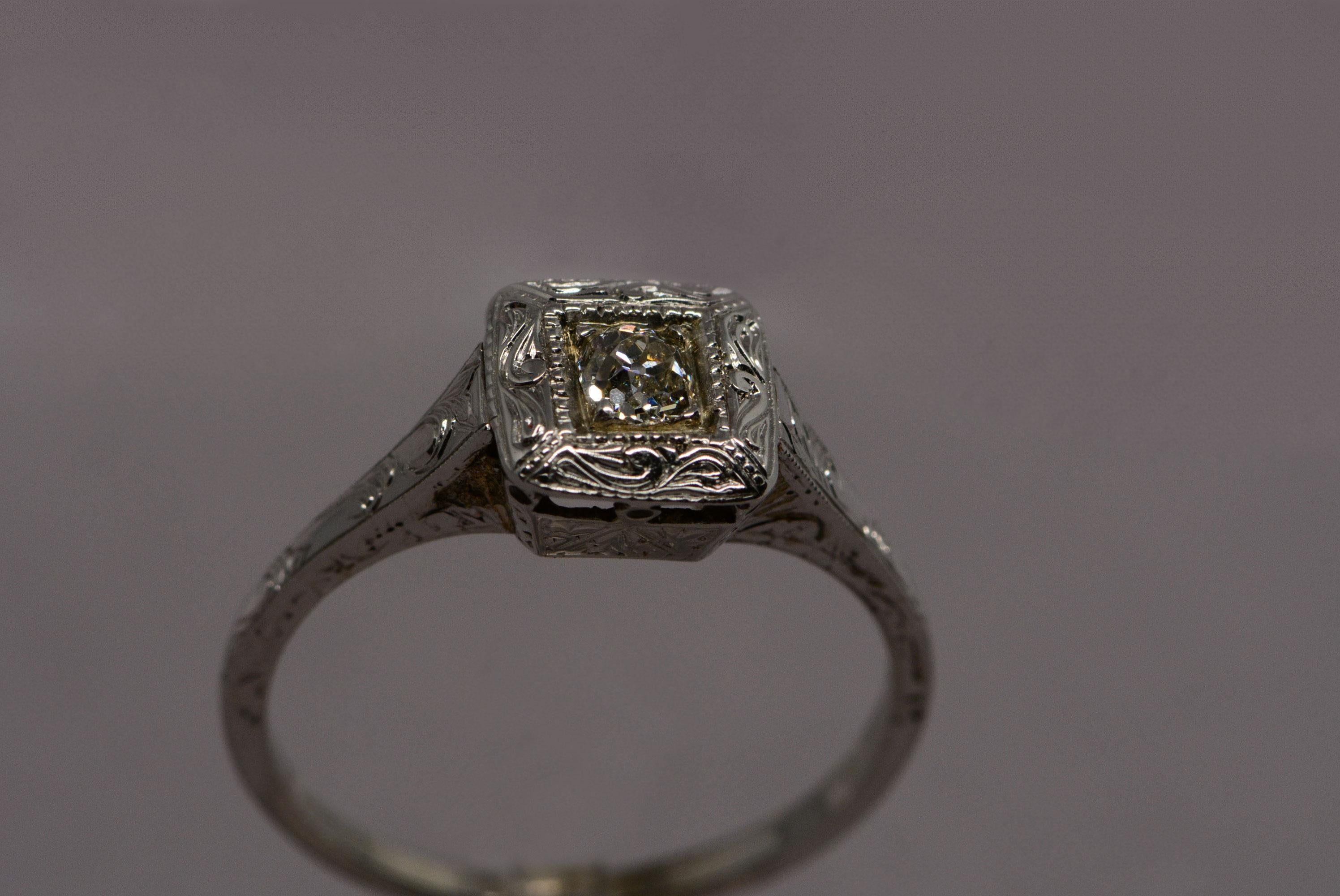 The antique diamond in this ring is an old mine cut, with the coveted small table and high crown angles that makes it sparkle like a little fireball. If you want a lively old mine cut that has good play of light, this diamond is it.
The diamond is