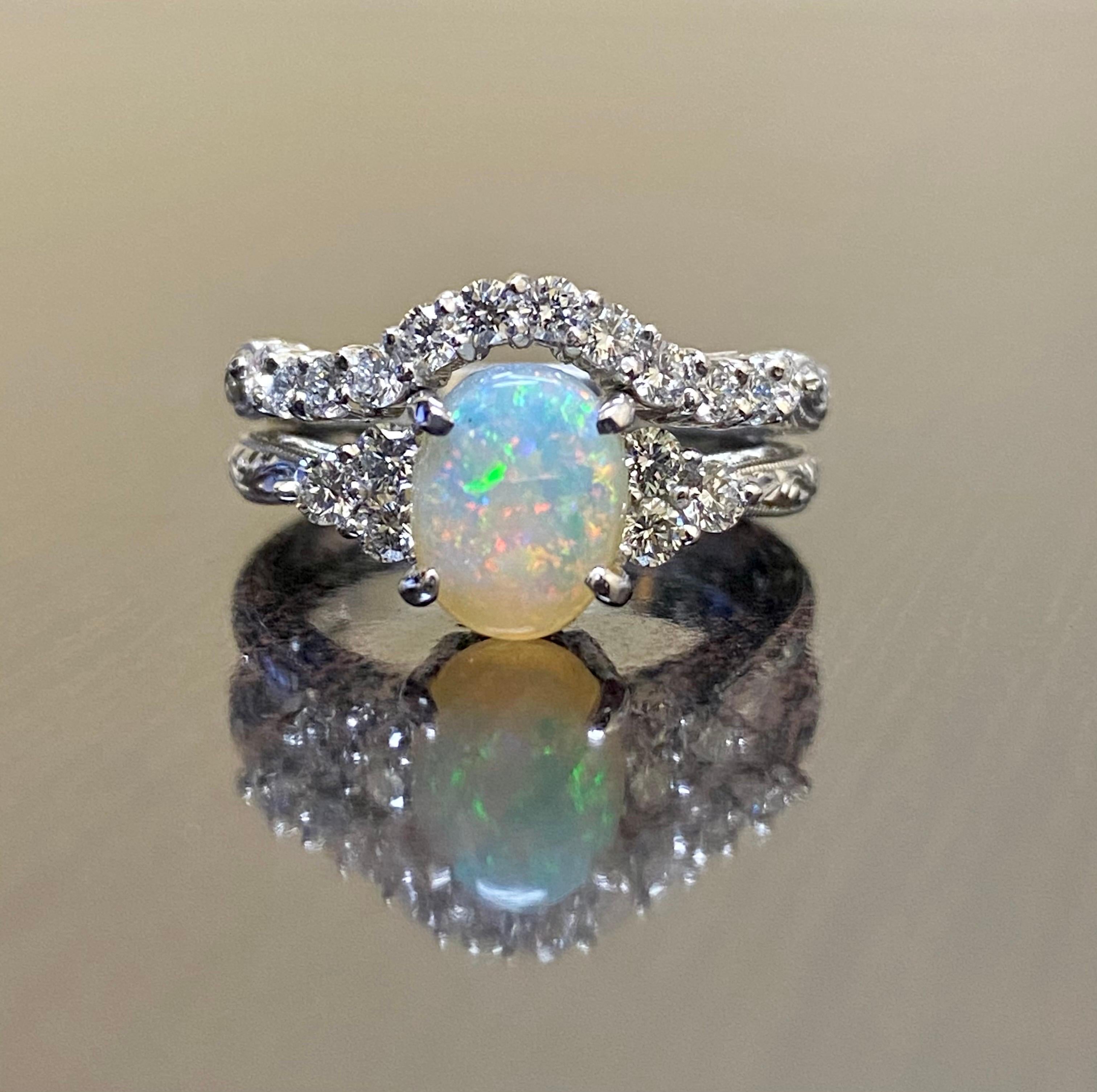 DeKara Designs Collection

Our latest design! An elegant and lustrous Opal cabochon and diamond platinum entirely handmade and hand engraved engagement ring with matching band.

Metal- 90% Platinum, 10% Iridium.

Stones- Engagement Ring Center