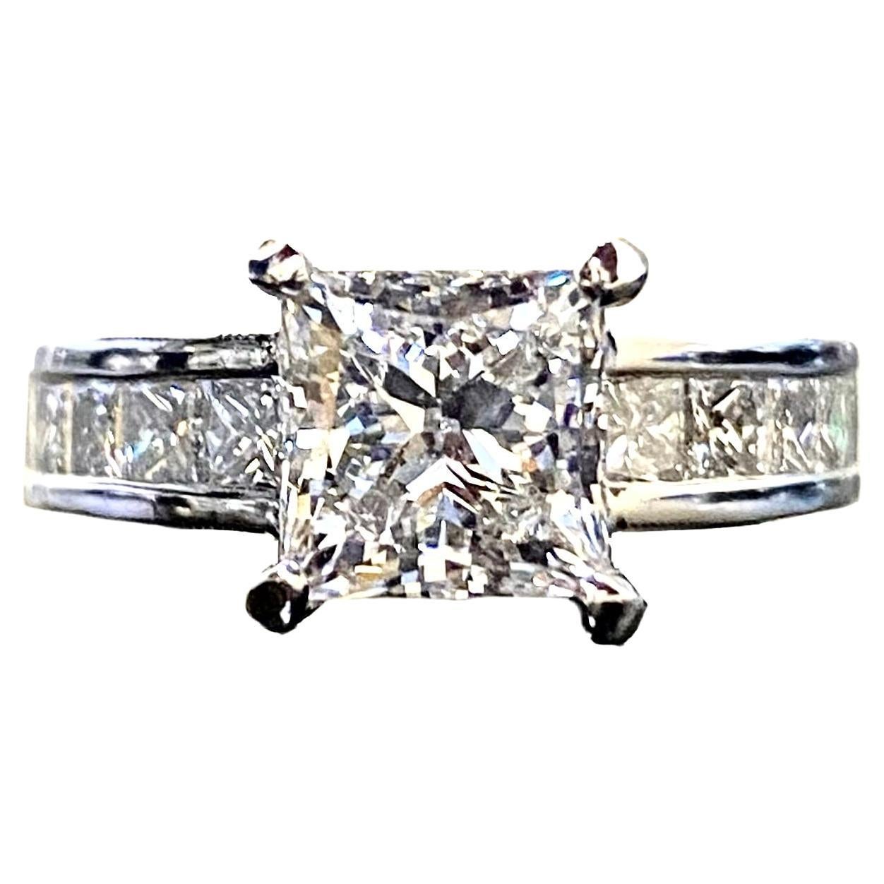 DeKara Designs Collection

Metal- 90% Platinum, 10% Iridium.

Stones- GIA Certified Princess Cut Diamond E Color SI1 Clarity 2.01 Carats, 12 Princess Cut Diamonds F-G Color VS1-VS2 Clarity 1.10 Carats.

Ring Comes With GIA Certificate.

GIA Report