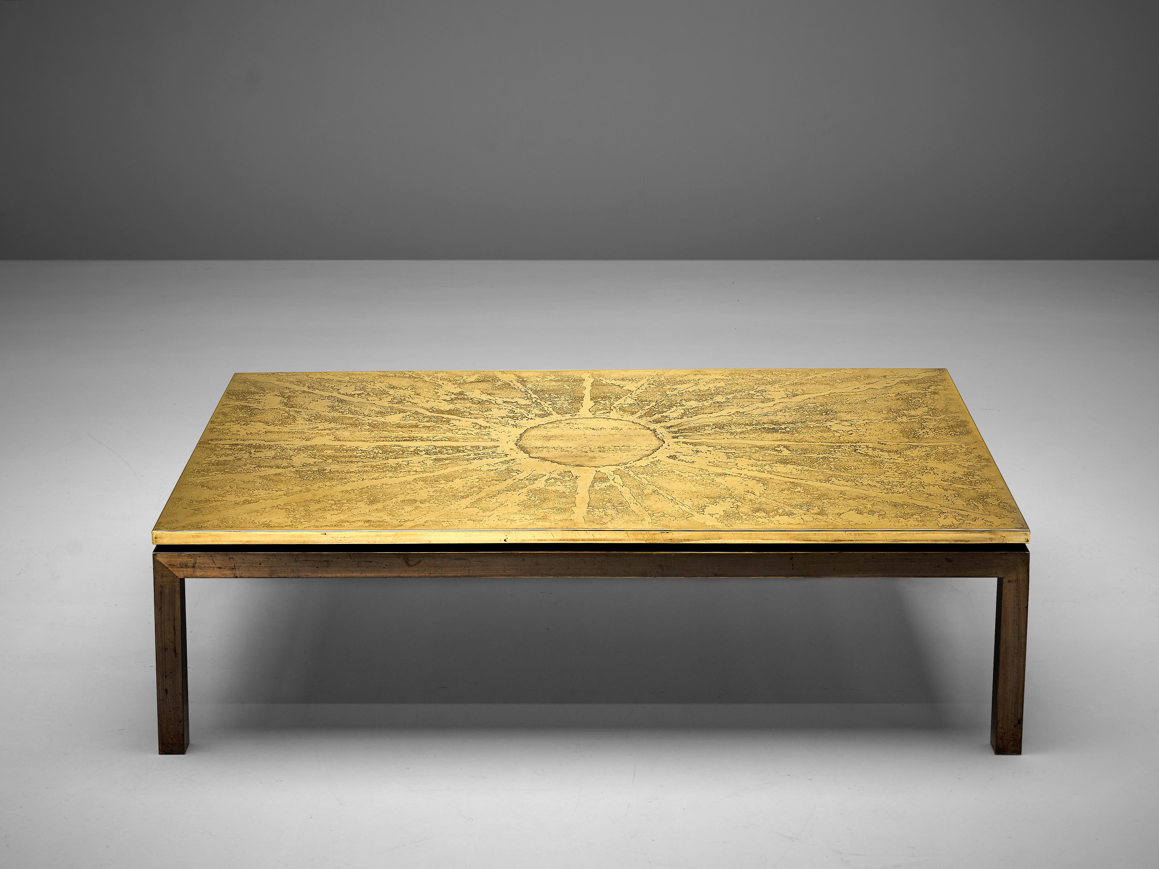 Coffee table, brass, metal, Belgium, 1970s

This hand-crafted Belgium side table has a grand appearance. The hand-etched tabletop in brass provides a wonderful abstract motive reminding of a sun. From a circle in the center many rays in vivid