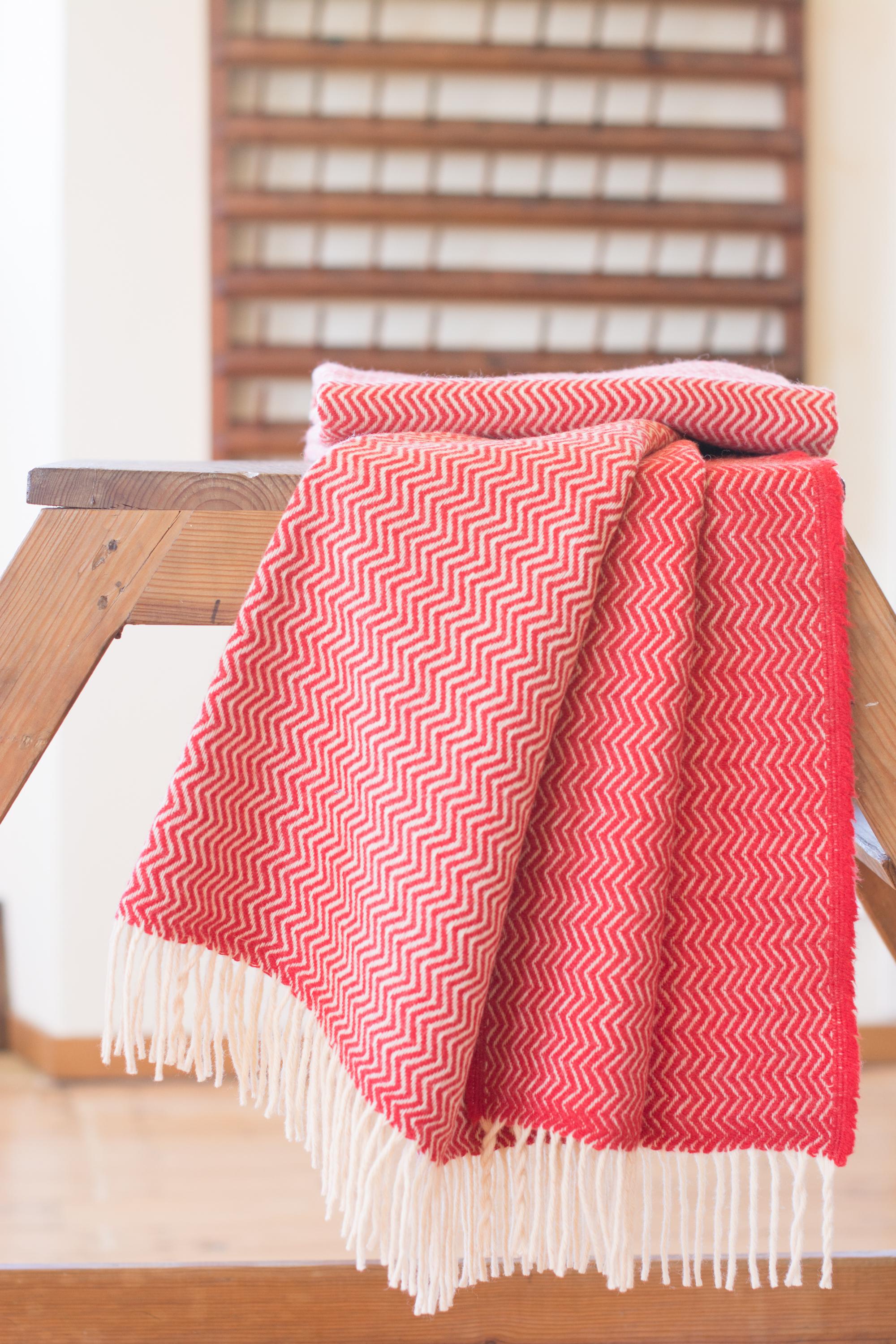 The Otilia hand finished organic wave design wool blanket/throw has been created by an incredible and unique family owned weaving and textile company in Portugal. This company impressed us so much by their commitment to working with the environment,
