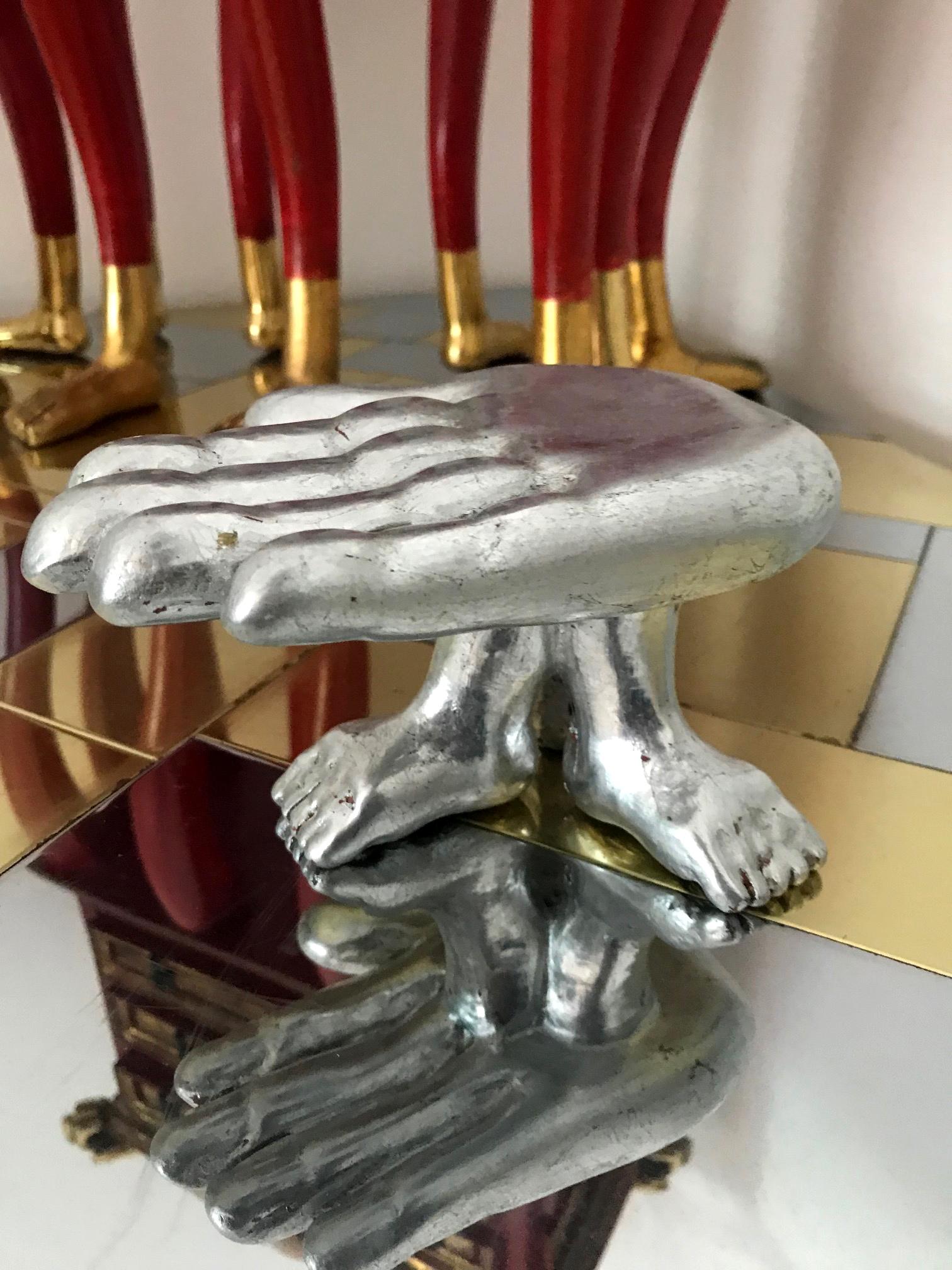 A sculptural wood miniature table by celebrated Mexican surrealism artist and designer Pedro Friedeberg, circa 1970s. In a less common and desirable silver leaf finish and features three connected feet supporting the palm. Signed to underside 