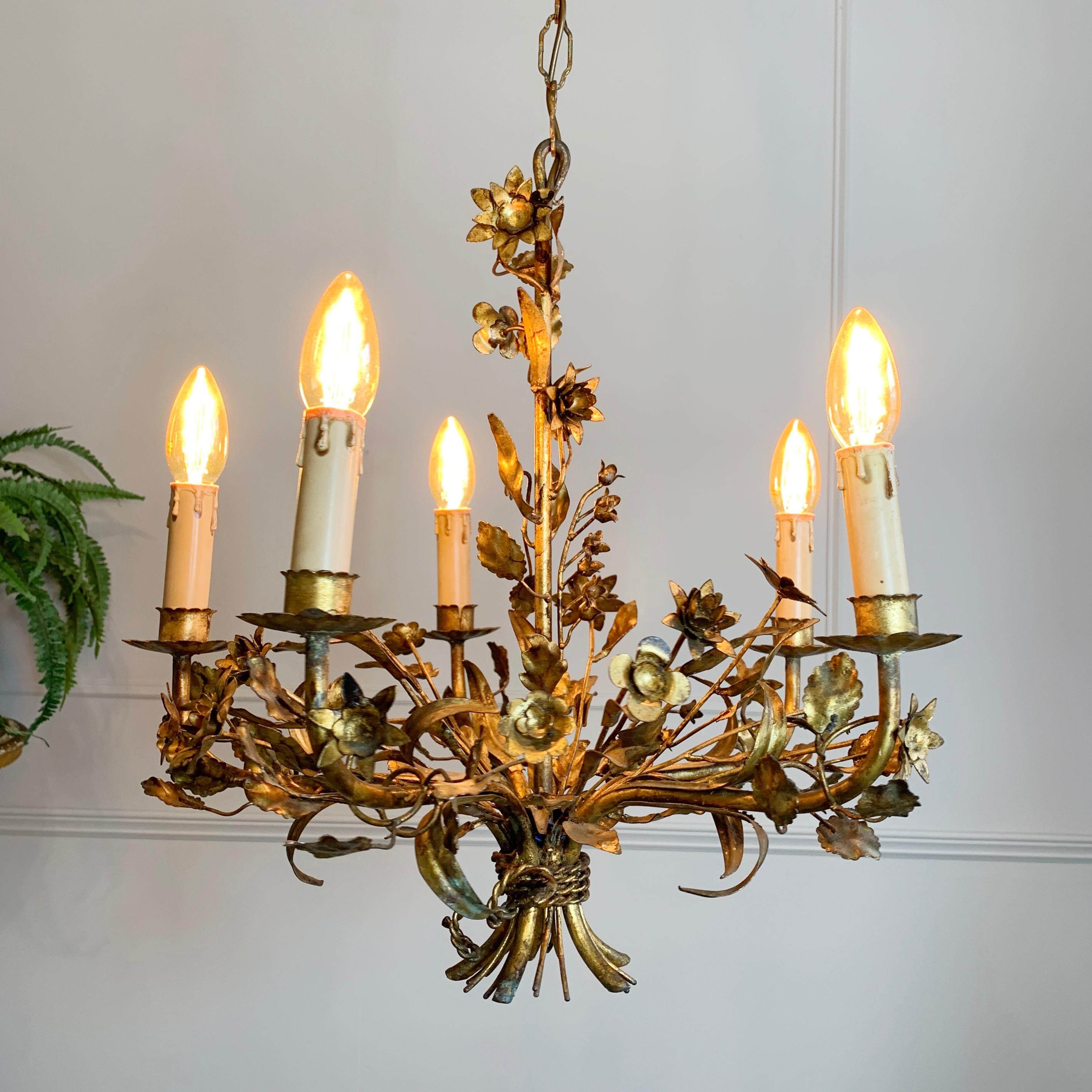 1940's gilt French flowers chandelier
The light is filled with beautifully handcrafted metal flowers and leaves, entwined around the main stem and arms of the chandelier
The light is an original vintage piece so has signs of wear and use
Total