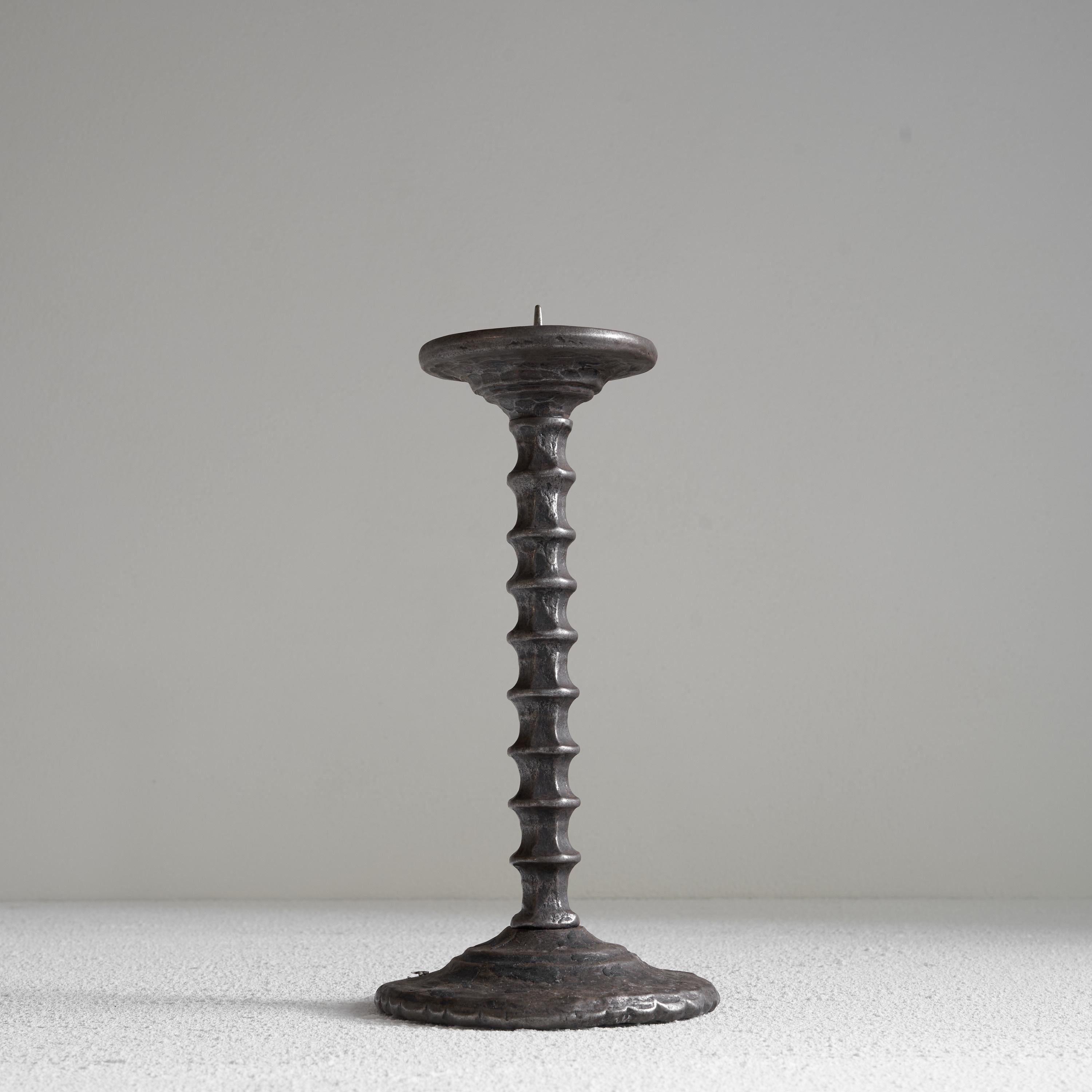Hand forged Brutalist candle holder in metal. Mid 20th century. 

This is a special hand crafted brutalist candle holder in forged metal. Really interesting shapes and use of the material, which makes this candle holder something to behold in your