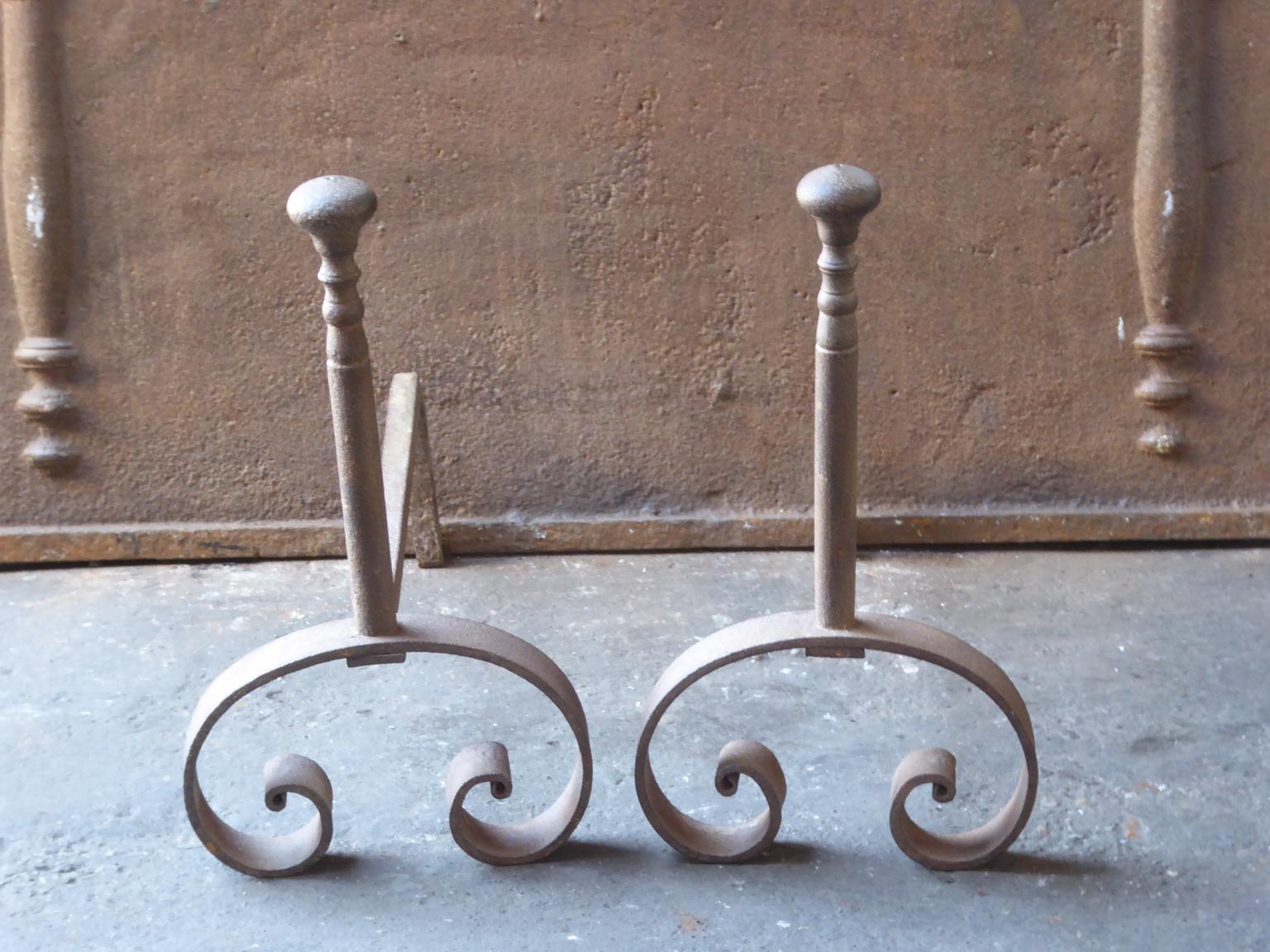 19th century French Napoleon III andirons made of hand forged wrought iron. The andirons are in a good condition and fit for use in the fireplace.