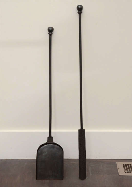Hand-forged iron fire poker and shovel set with modern finials. Small, artisan-scale production and quality. 

Made-to-order with a 6-8 week lead time. 

 