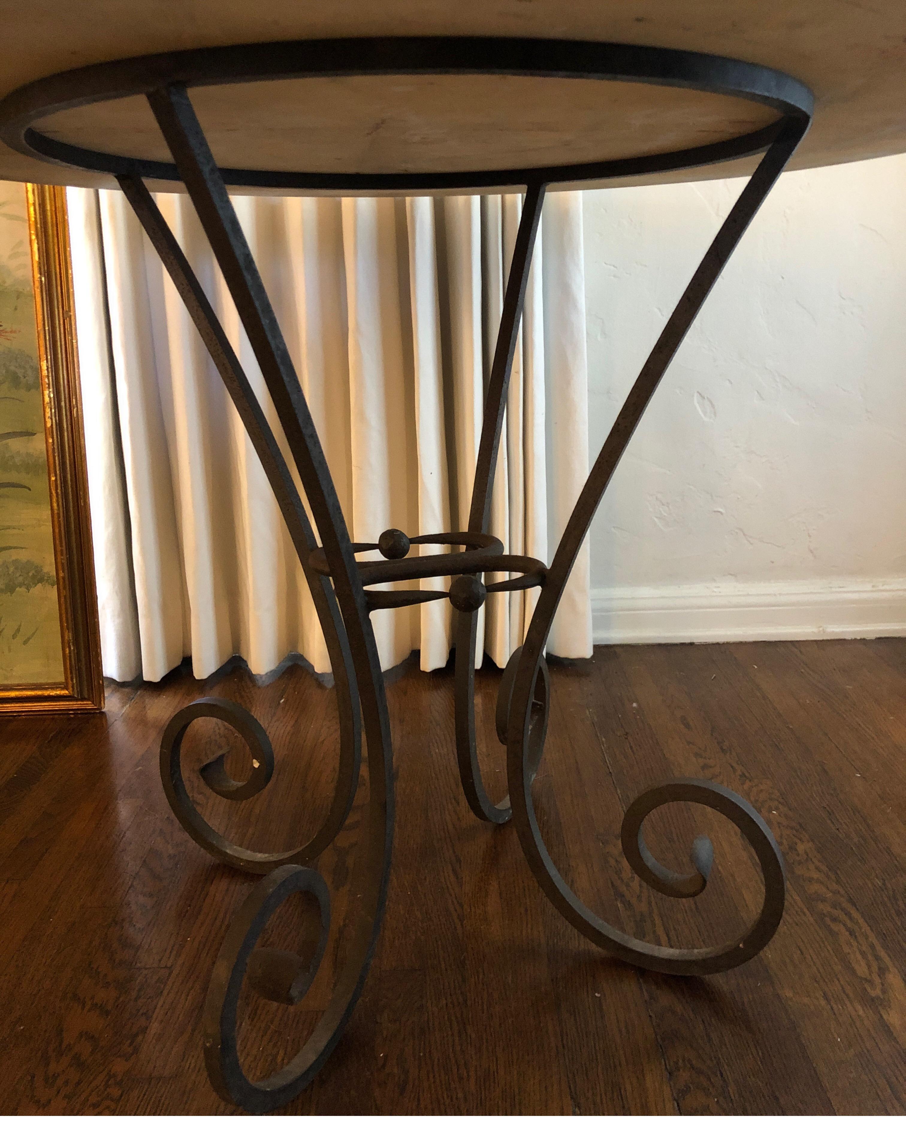 Antique hand forged Spanish iron table base with white marble top.
4 curved legs and two unique turned iron with two balls in the center. 

White Carrara marble measuring 42