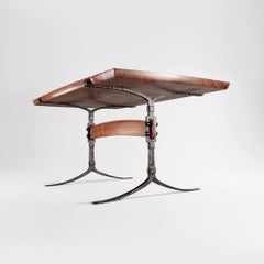 Hand-forged steel and wood trestle dining table with California walnut top