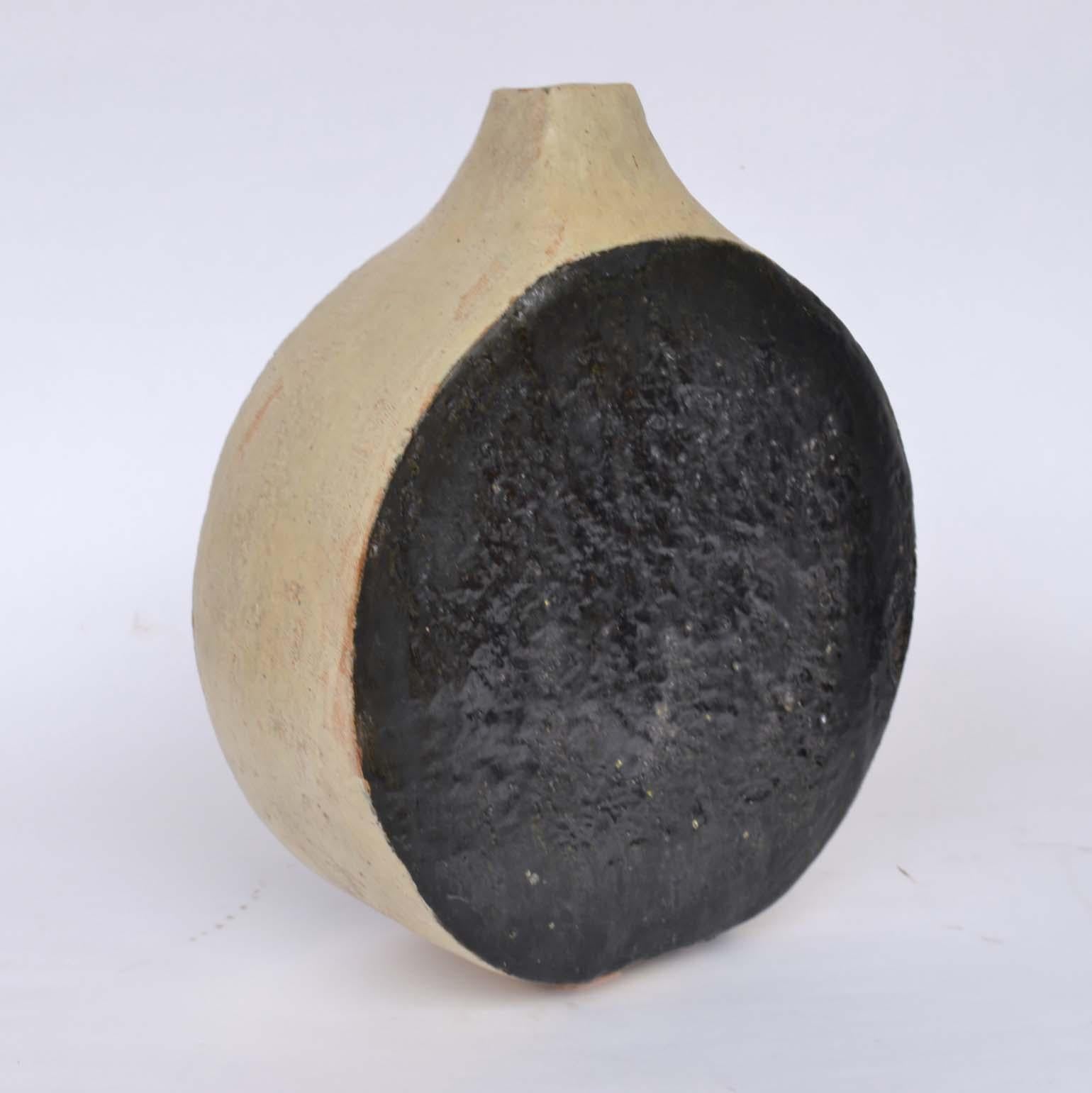 1960s hand formed studio pottery by the artist Krystyna Czelny. B 1923 in Poland and living in the UK. 
She is also known for her busts and portraits.

Tall cylinder vase black: Height 43 cm, W 11 cm, £750
Round and flat black and white vase: H