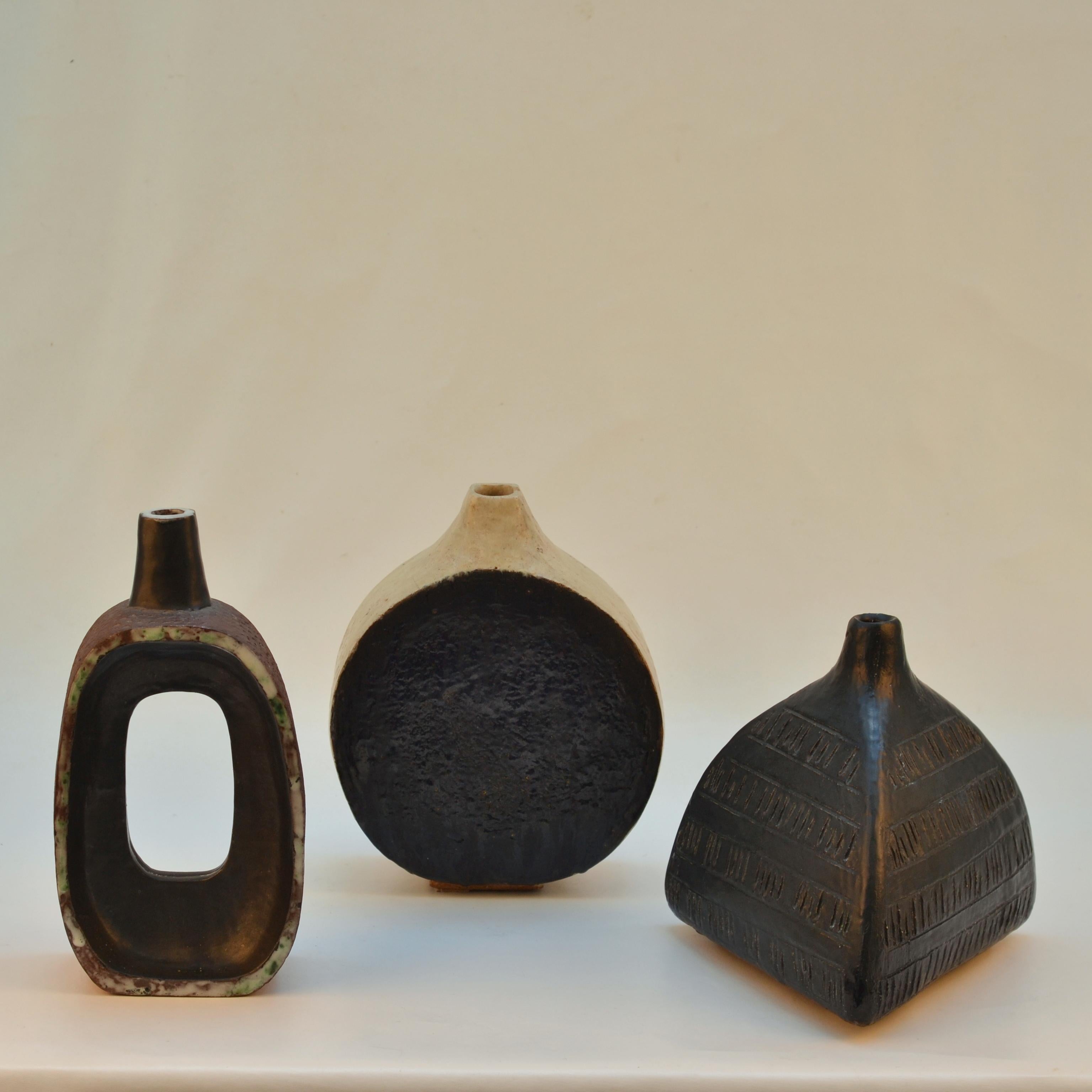 Three unique 1960's hand formed studio pottery by the artist Krystyna Czelny. B 1923 in Poland and living in the UK. 
She is also known for her figurative art of busts and portraits.

Dimensions
Round and flat black and white vase: H 23 cm, W 20