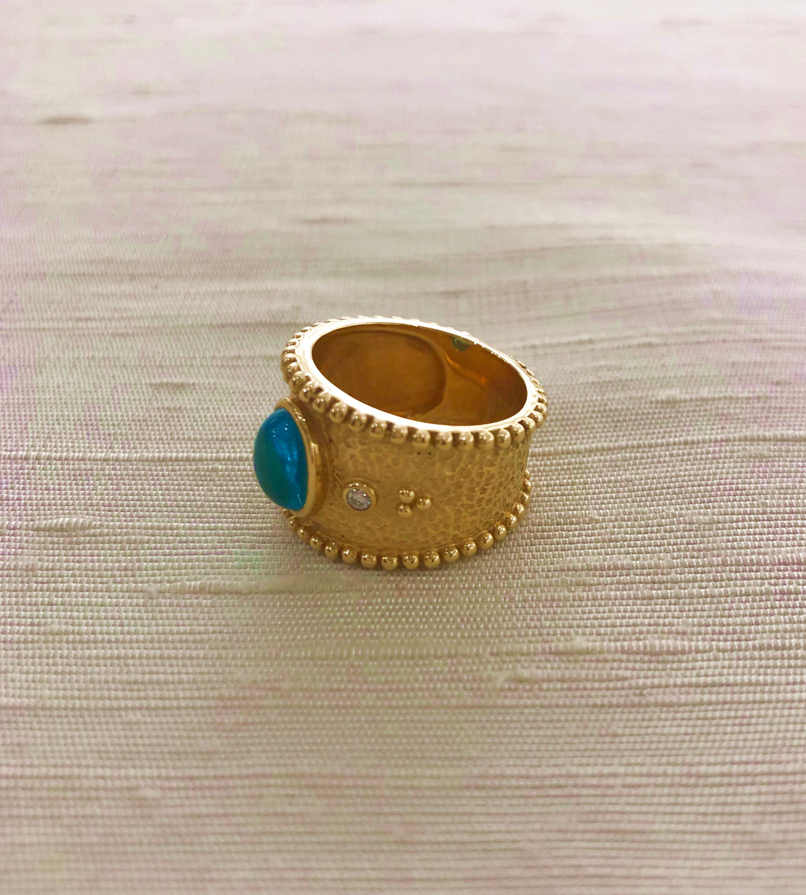 Contemporary 18 Karat Gold Ring with Oval Cabochon Blue Tourmaline and Diamonds