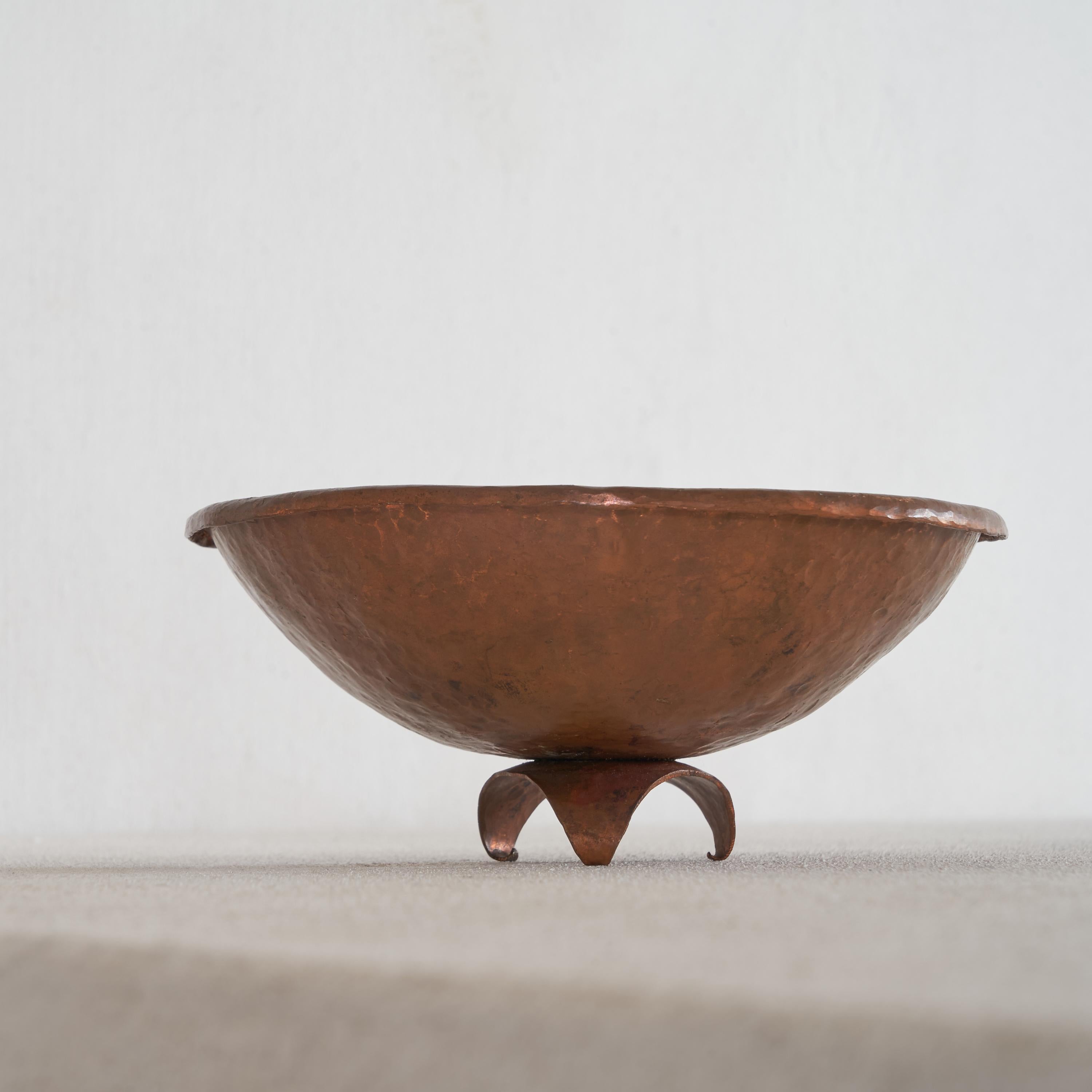 Beautiful little hand hammered bowl in copper with playful feet. Simple forms but very sculptural and the hand hammered top rim is a piece of art itself.
 
Probably from a mid century church. We also have a matching wall mounted bowl available.