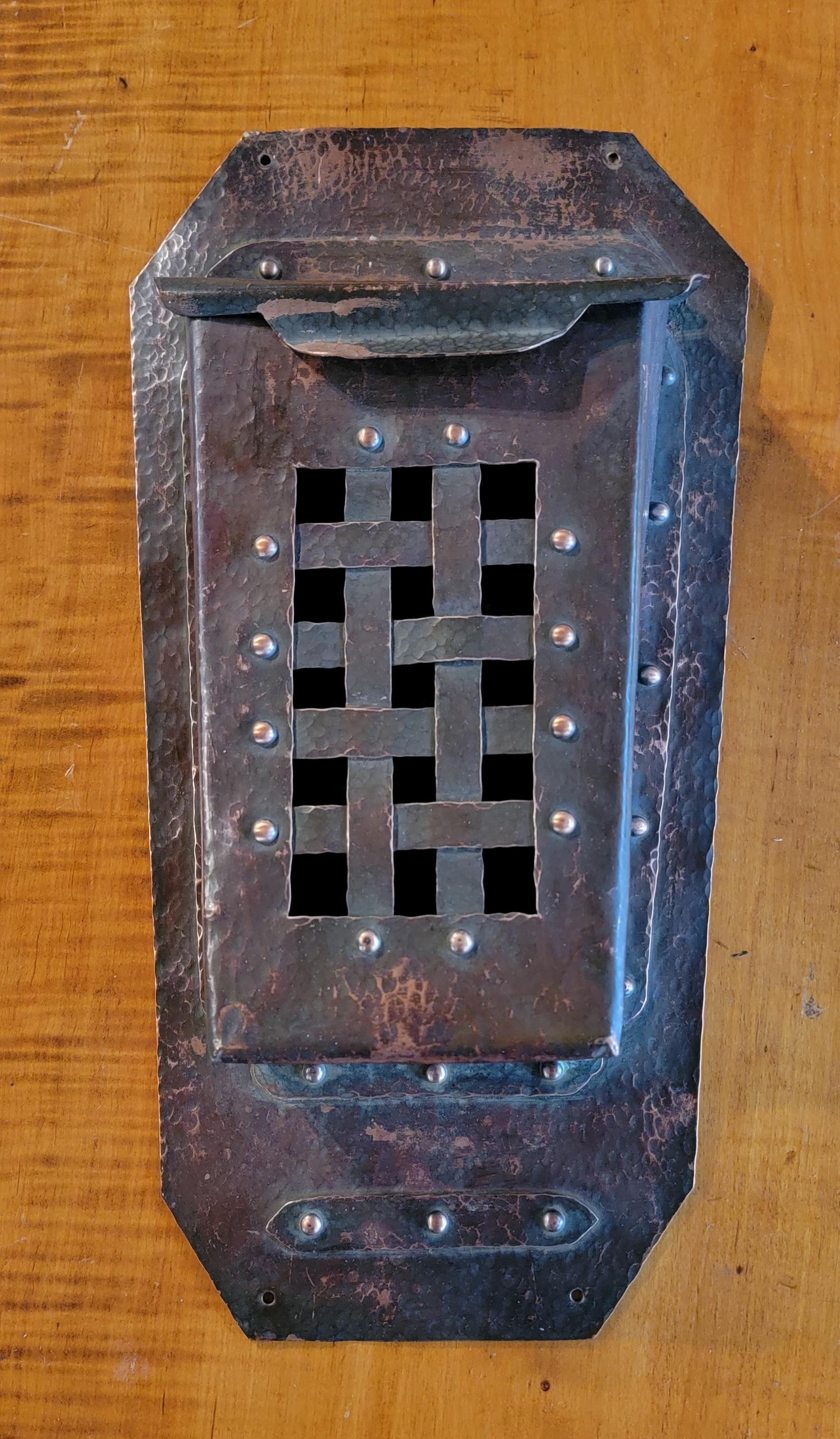 Hand hammered and riveted solid copper letter of mailbox, circa. 1910. Fine craftsmanship, beautiful patina. Basket weave front and hinged lid. Maker unknown.