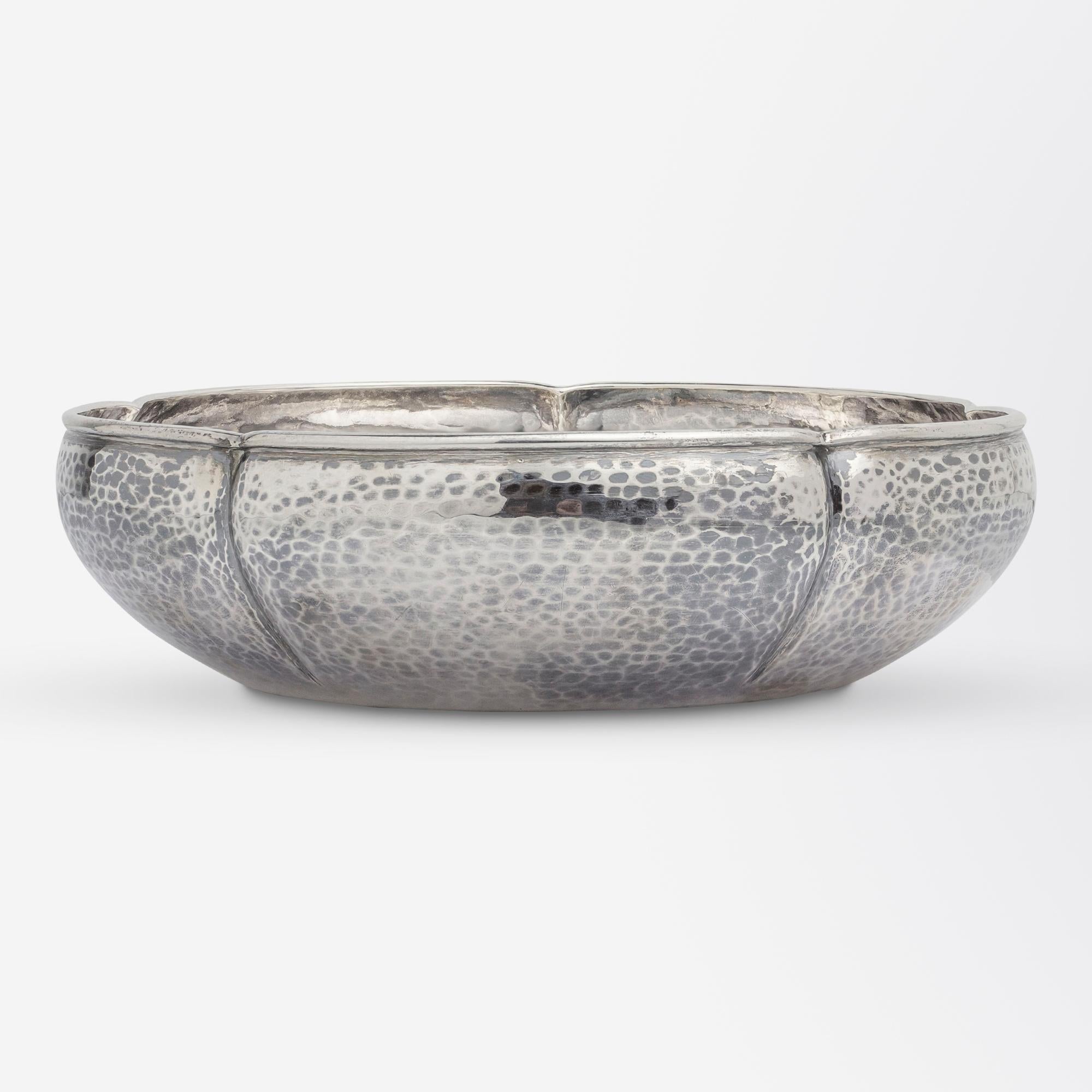 This hand hammered sterling silver bowl by was made by Chicago firm 'The Kalo Shop'. Completely hand wrought the piece is in the American Arts and Crafts taste of the early 20th Century and features distinctive signs of hand hammering by the