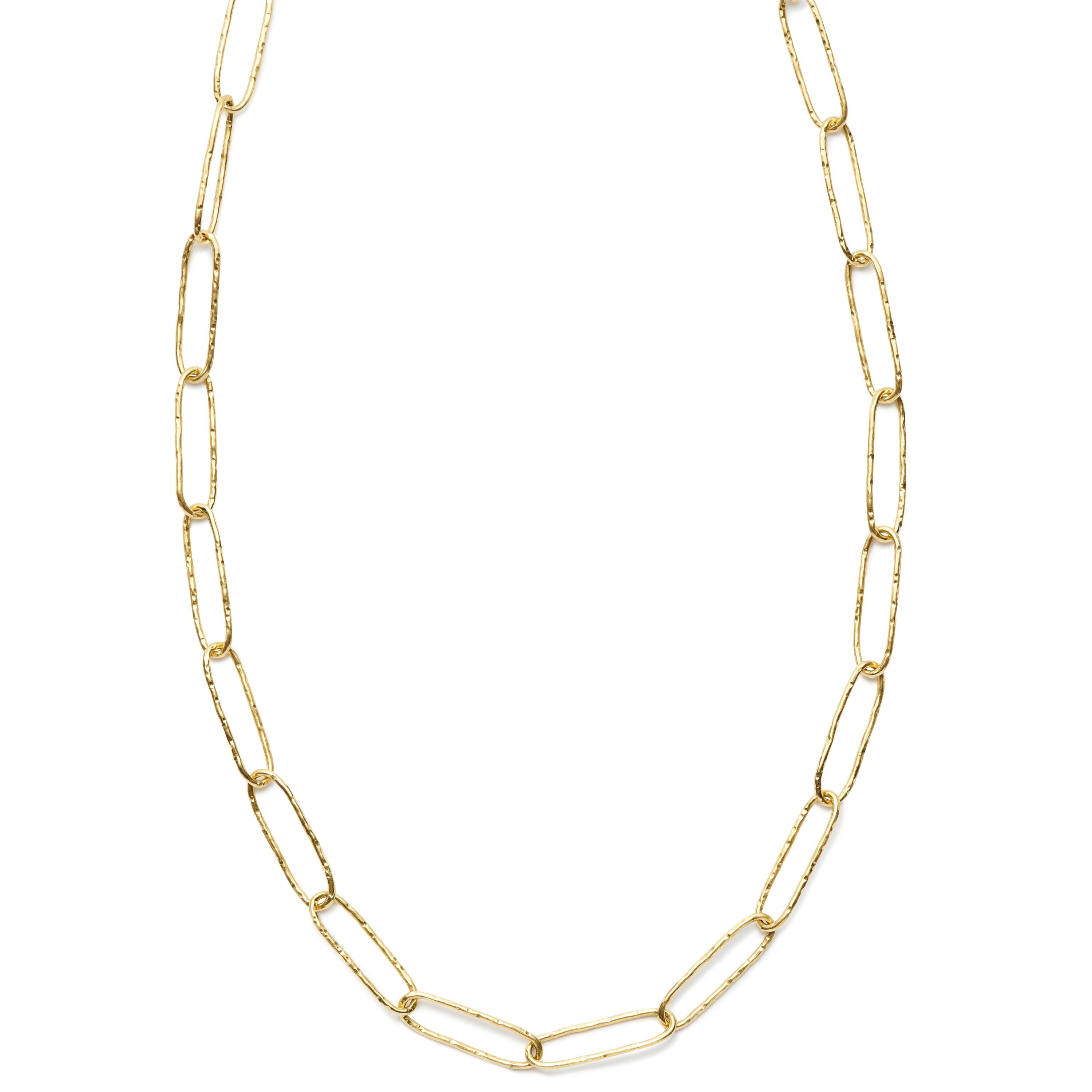 A modern accessory with a twist. This fun and fashionable 27-inch hand-hammered necklace, crafted in a paper clip design, can be worn on its own or layered with other chains or pearls. Available in 18 Karat Gold and Sterling Silver.
