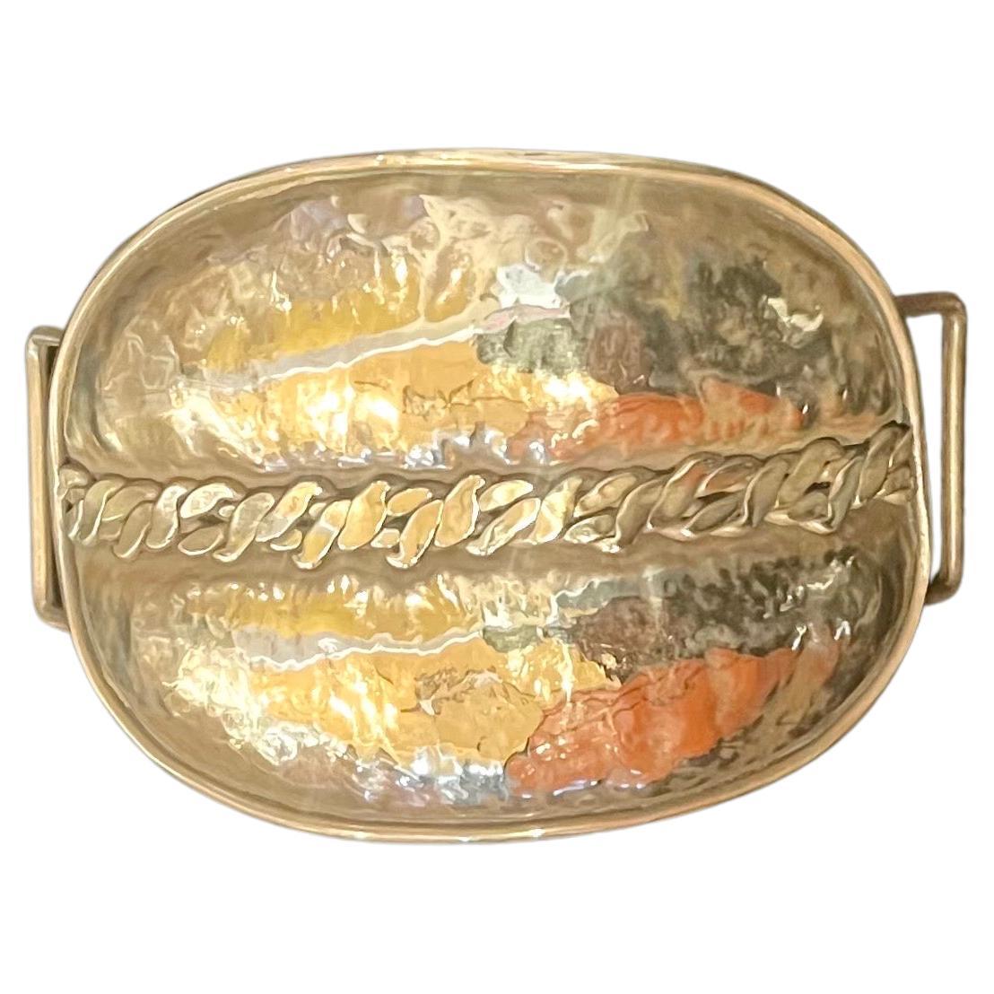 Beautiful Brutalist style hand hammered solid brass woman's belt buckle, circa 1970s, we polished the piece look striking.
