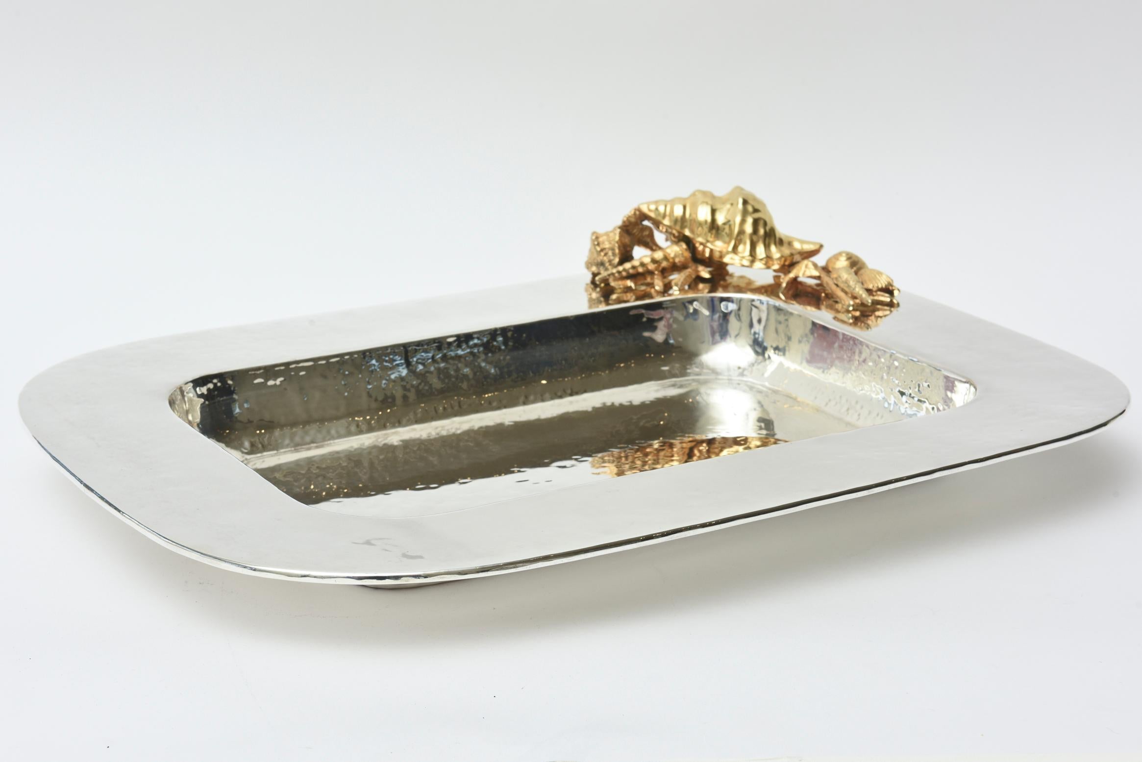 This stunning hand-hammered silver plate rectangular tray has embellishments on the top of one side in 24-carat gold-plated forms of assorted dimensional shells. It is signed but not legible even through a macro lens but looks like some form of