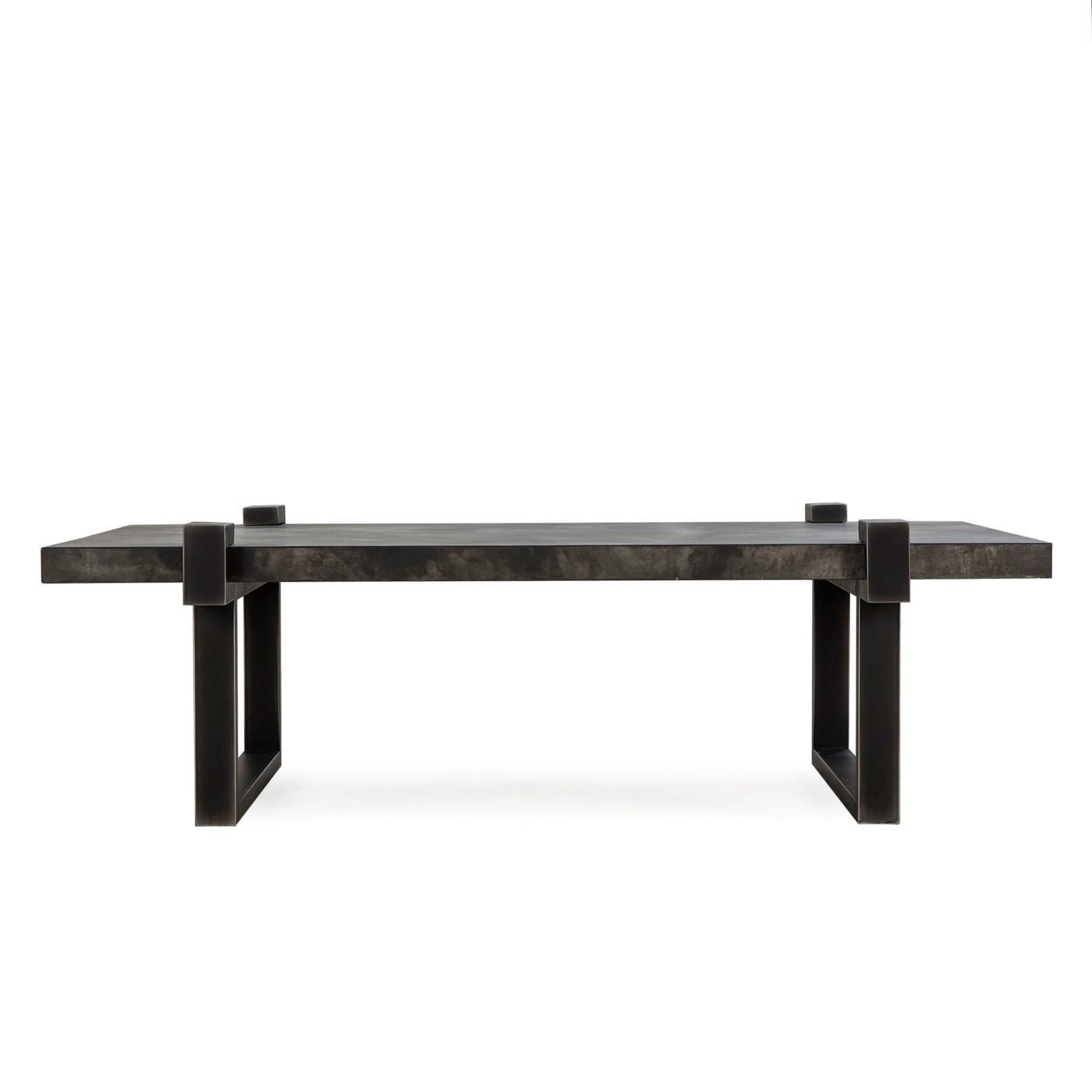 hand-hammered metal cocktail table featuring a thick blackened metal top paired with a metal base.
The simple Industrial chic design adds a contemporary touch in the space.
Product dimensions:
Inches: 55 x 31.5 x 17
Materials: Hammered metal