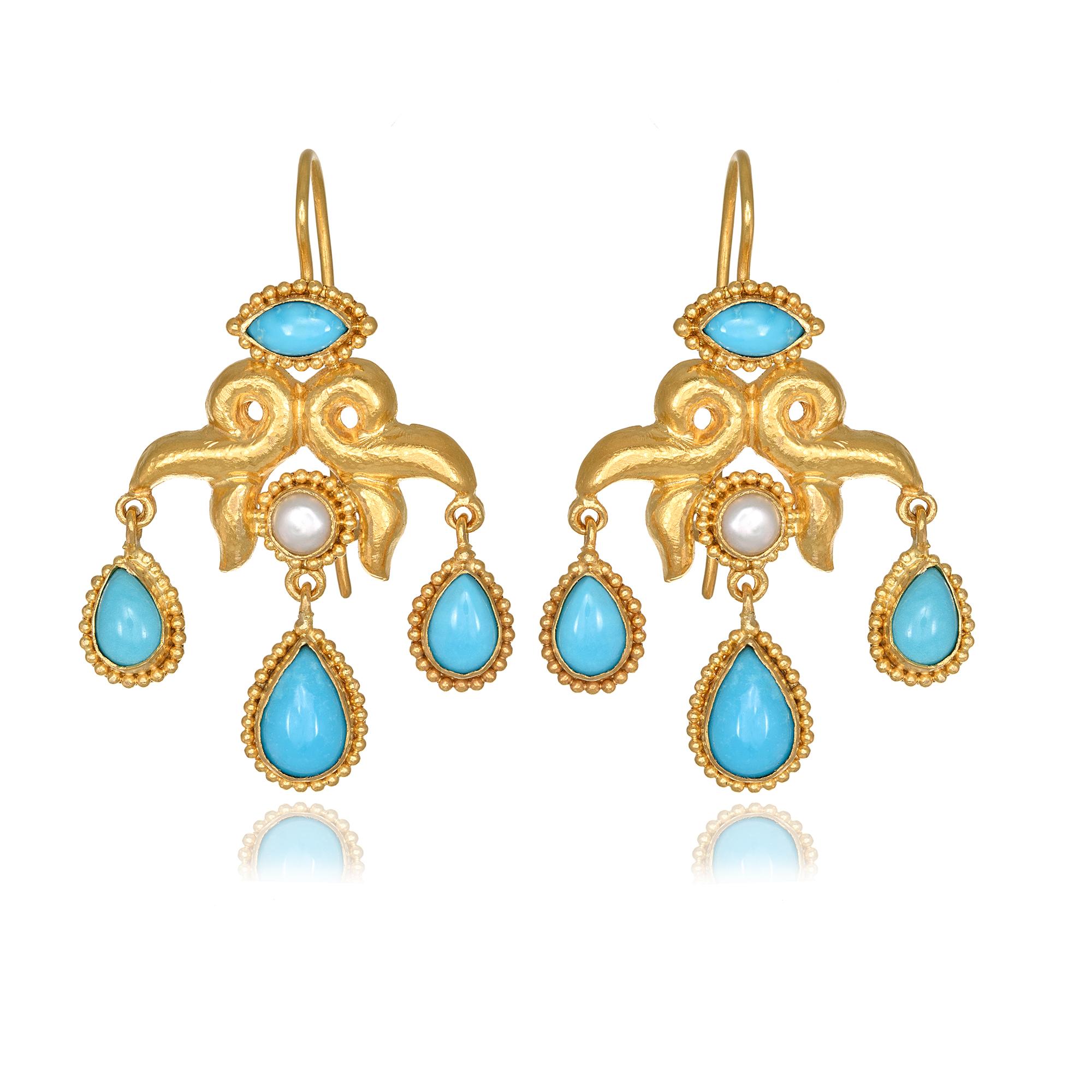 Chandeliers Earrings handcrafted in 22Kt yellow gold, featuring pear Turquoises and Pearl.  This pair of earrings is braided according to the traditional techniques of hand hammering and granulation. The play of light and shade across the pattern of