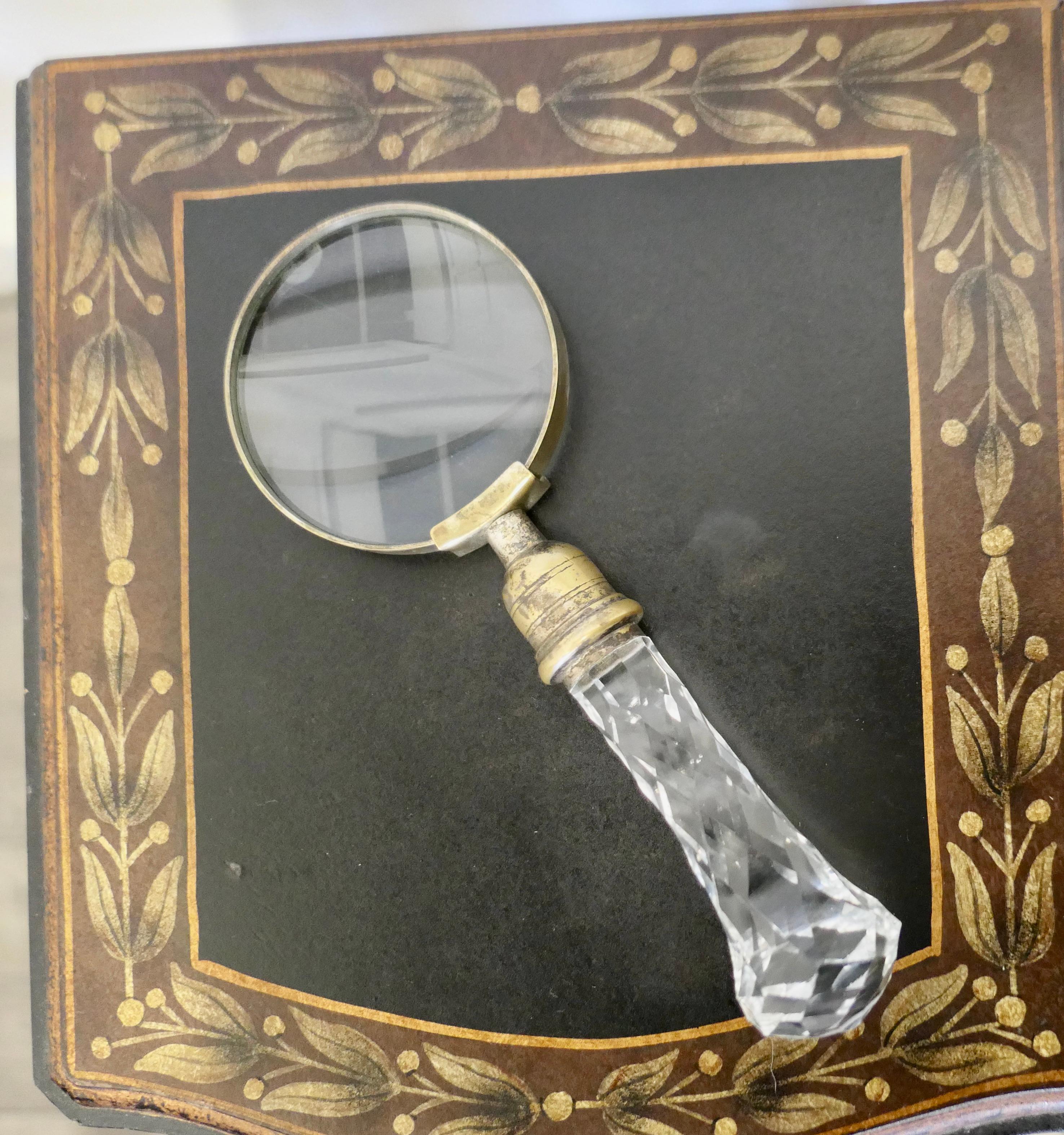 Hand Held Magnifying Glass with Faceted Glass Handle

A lovely piece for your study in good vintage condition with a chunky knob handle
The Glass is 8” long, the lens is 3” in diameter.