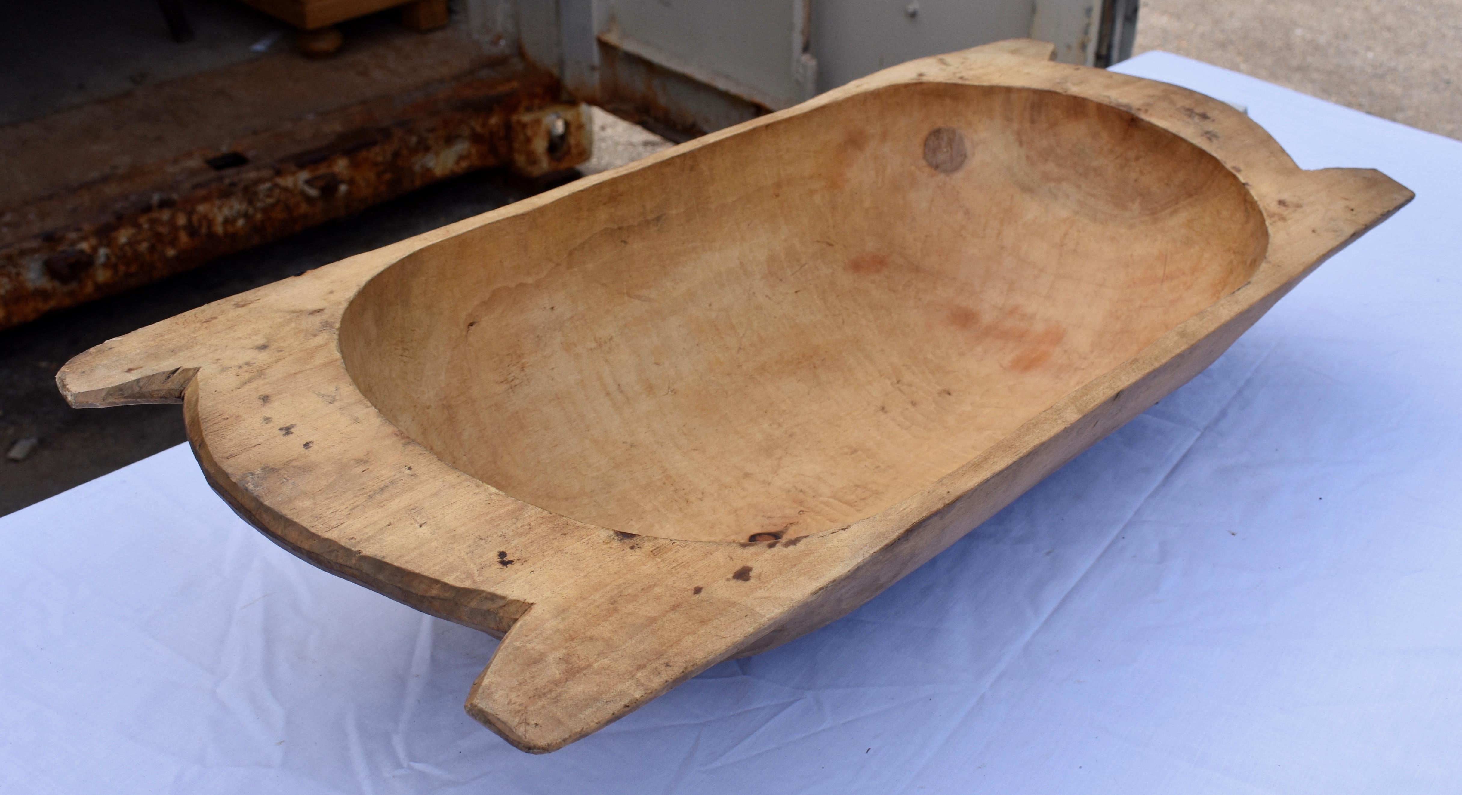 Our European antique wooden dough bowls or trogs were hand-hewn from whole split logs. They feature remarkable handiwork and a beautiful patina, especially when viewed from the underside. They all show signs of purposeful use. Some have small