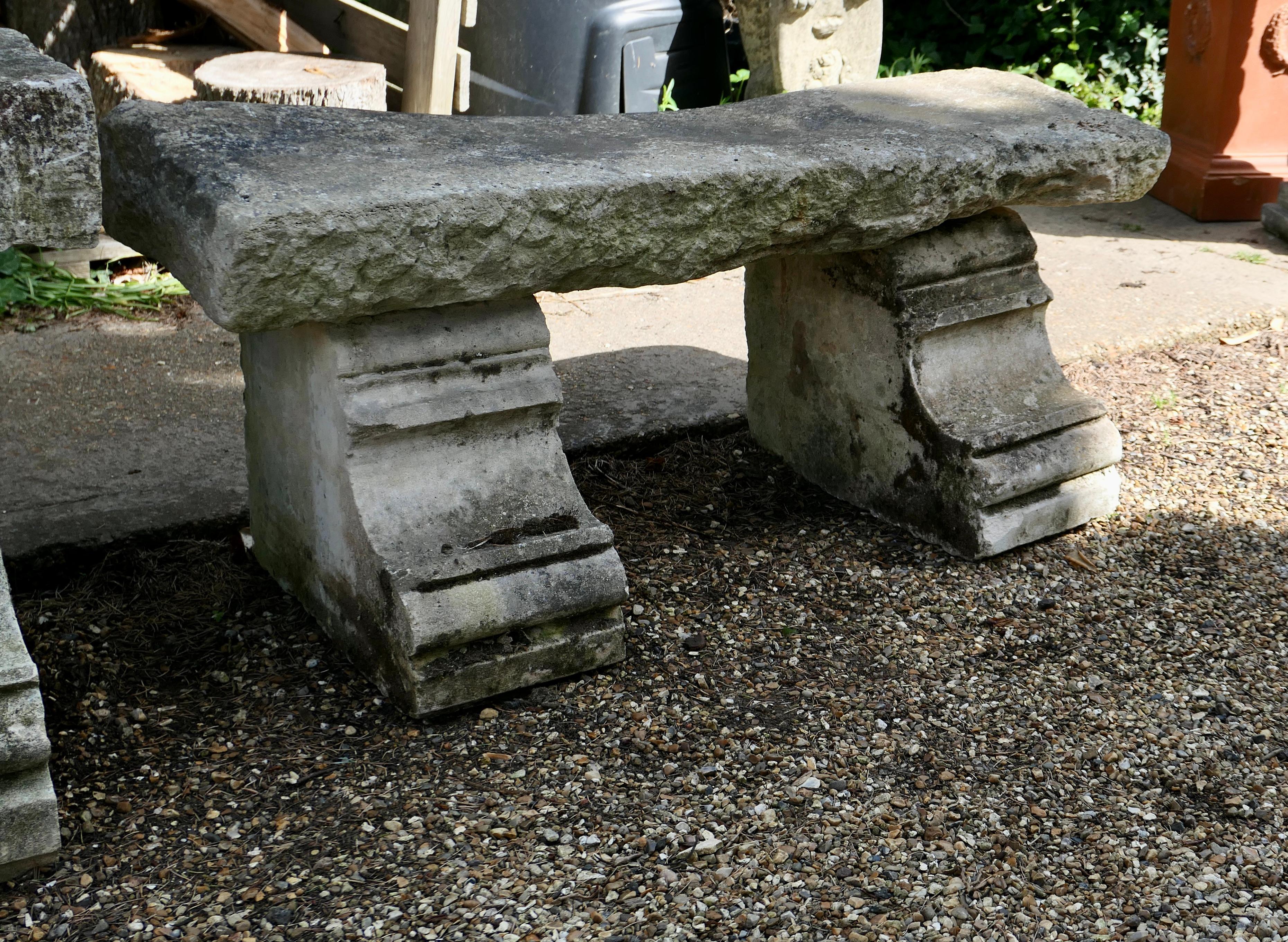 Hand Hewn Stone Garden Bench Seat 

A superb and very rare piece, the 5” thick solid single piece of Stone forms the top of the seat, its 2 strong legs are hand carved in a stepped fashion 
needless to say this is the heaviest garden bench available