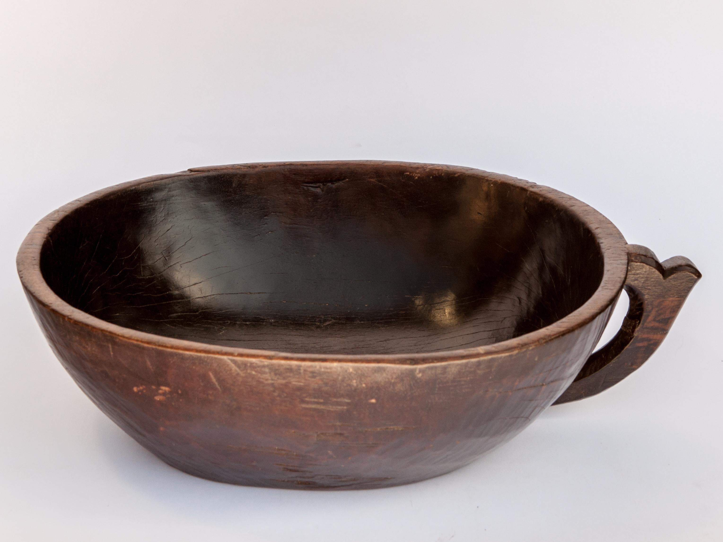 Tribal Hand Hewn Wooden Bowl with Handle from Sulawesi, Indonesia, Mid-20th Century