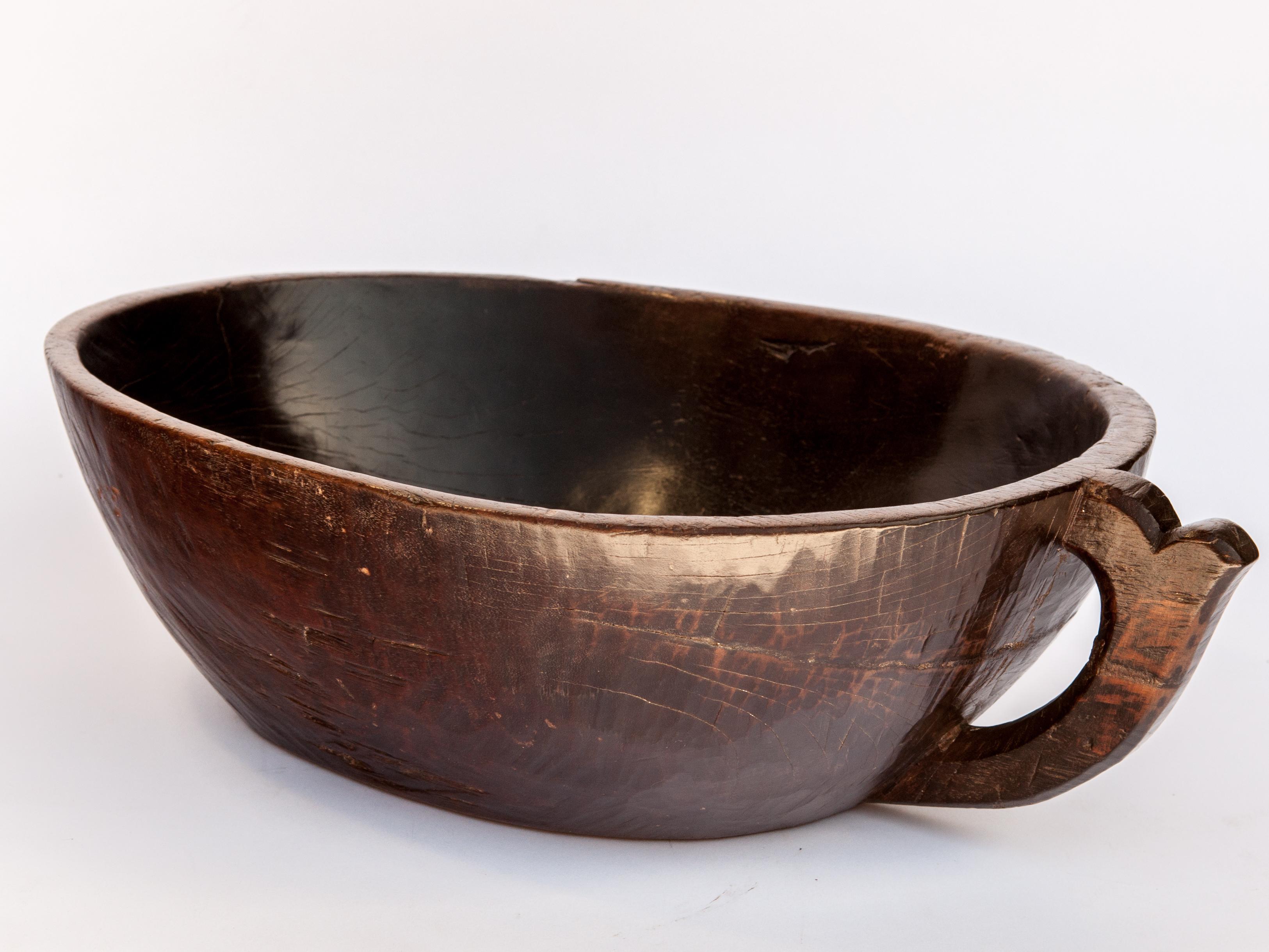 Indonesian Hand Hewn Wooden Bowl with Handle from Sulawesi, Indonesia, Mid-20th Century