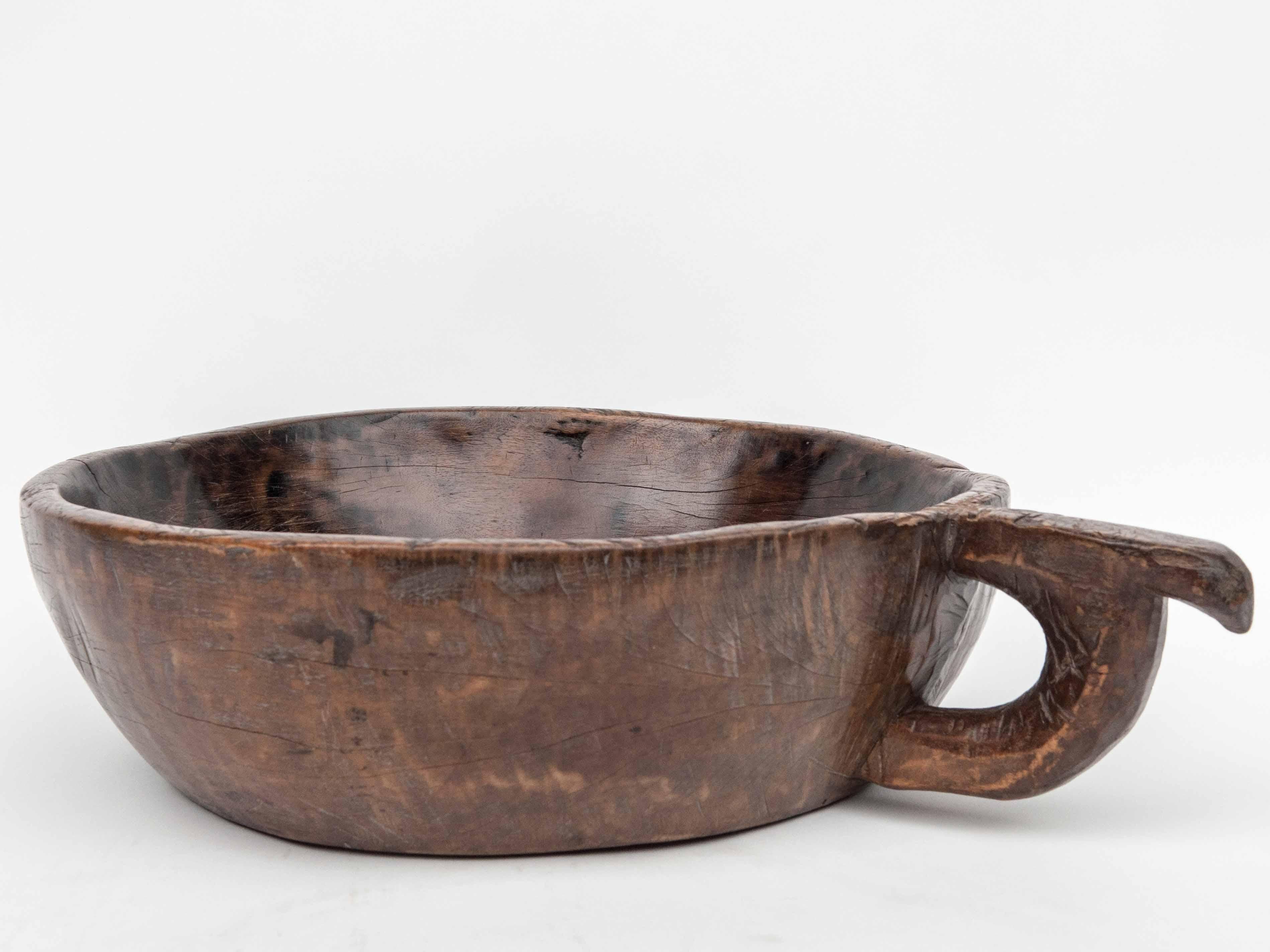 Hand Hewn Wooden Bowl with Handle Sulawesi, Indonesia. Mid-Late 20th Century In Good Condition In Point Richmond, CA