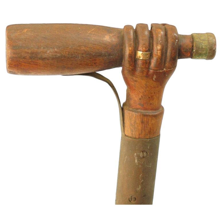 Hand Holding A Bottle Carved Cane For Sale