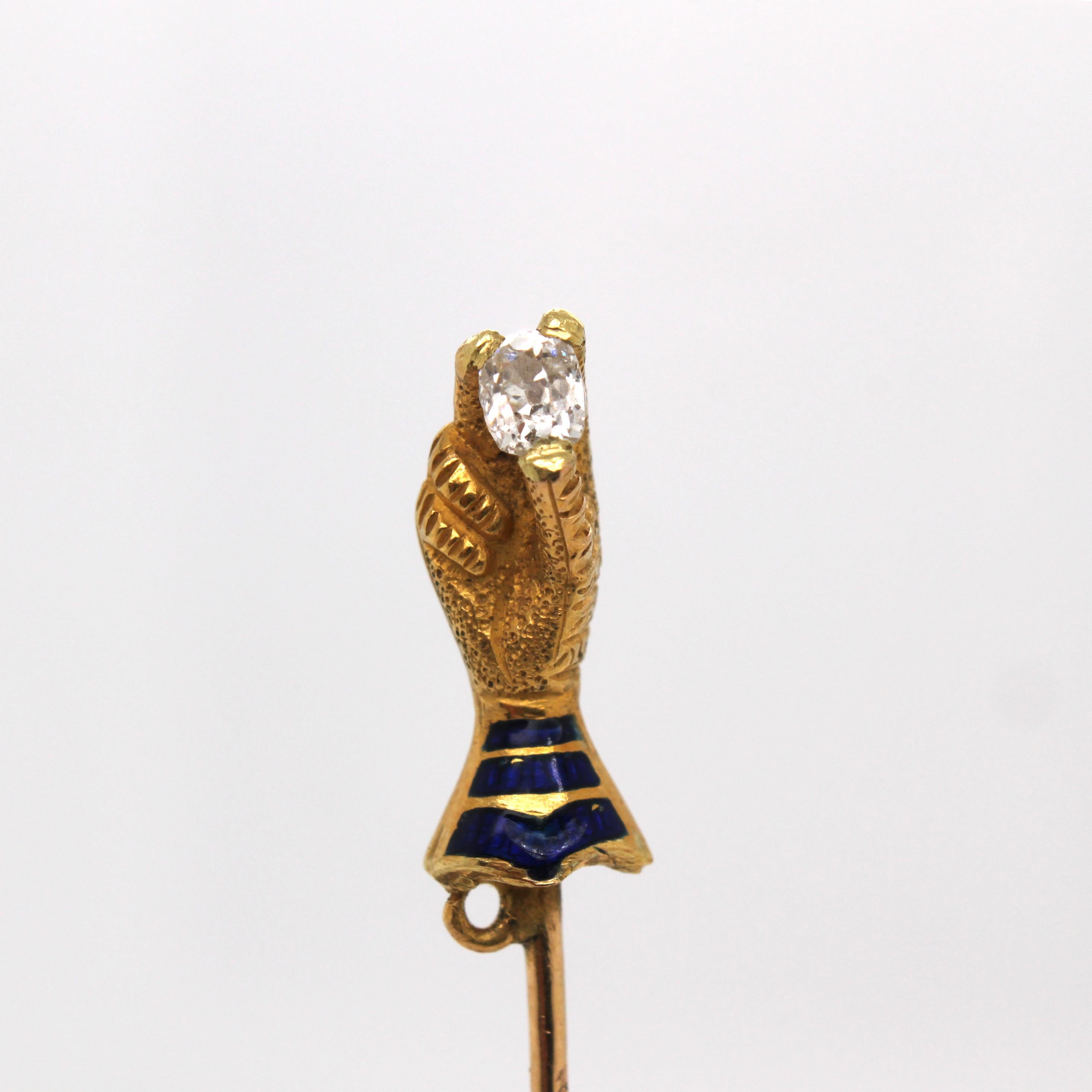 Hand Holding Diamond Enamel and Gold Stick Pin, ca. 1910s

A very unique stick pin, depicting a gloved hand holding a very sweet old-mine cushion cut diamond (ca. 0.2 carats). The hem of the glove is blue enamelled. The glove itself is made with